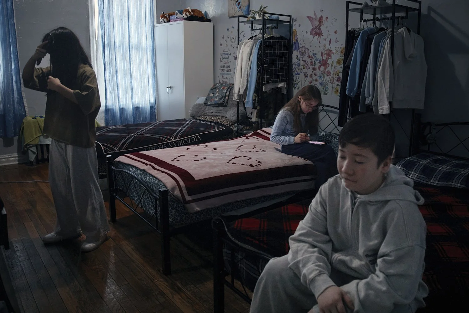  Gulhayo Yuldosheva’s kids get ready to go to school in a Bronx apartment building where tenants report maintenance issues, pest infestations on Tuesday, March 17, 2026, in New York. (AP Photo/Andres Kudacki) 