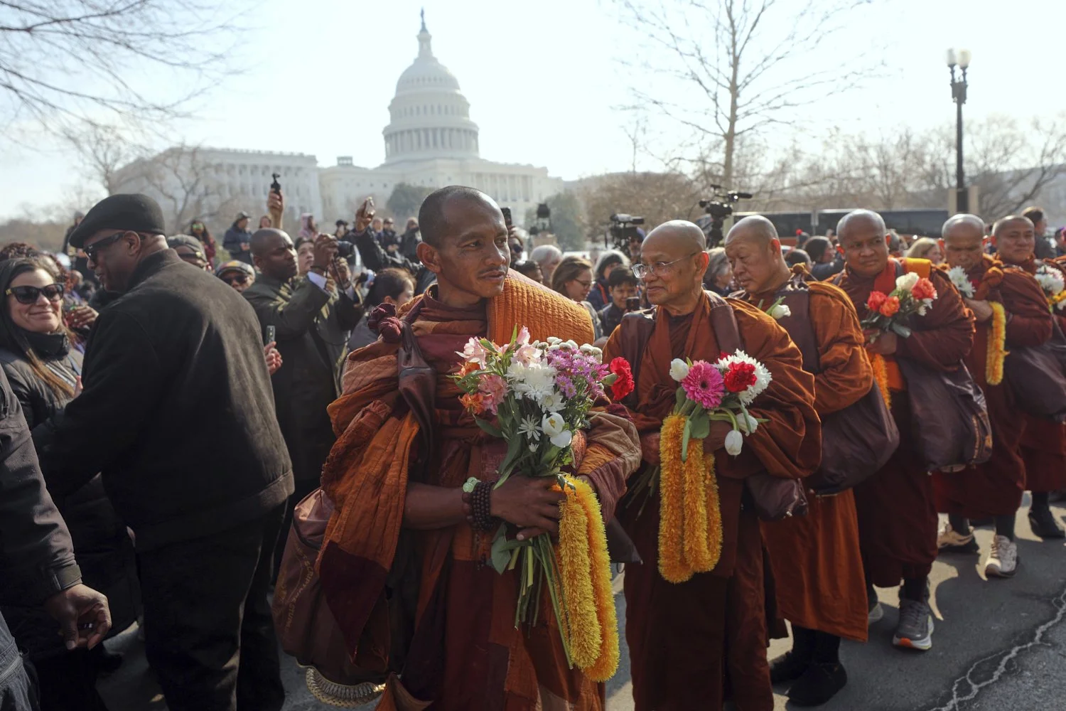  Buddhist monks walk on Capitol Hill as they wind up their Walk For Peace in Washington, Feb. 11, 2026. (AP Photo/Rahmat Gul) 