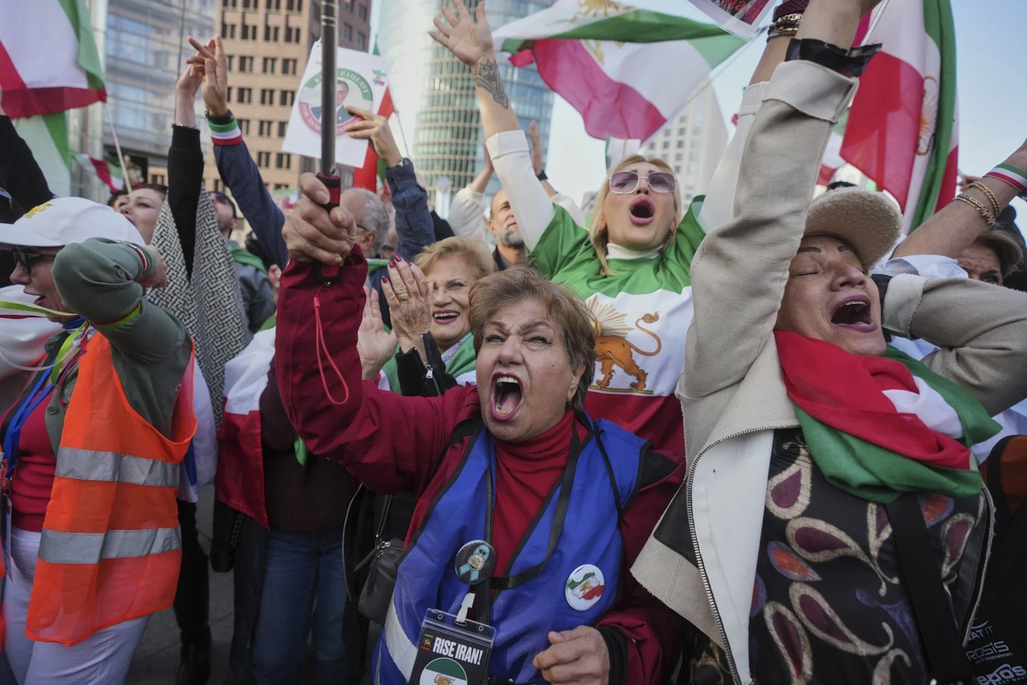  Iranians show their support for the U.S. and Israeli strikes on Iran, in Berlin, Germany, Feb. 28, 2026. (AP Photo/Markus Schreiber) 