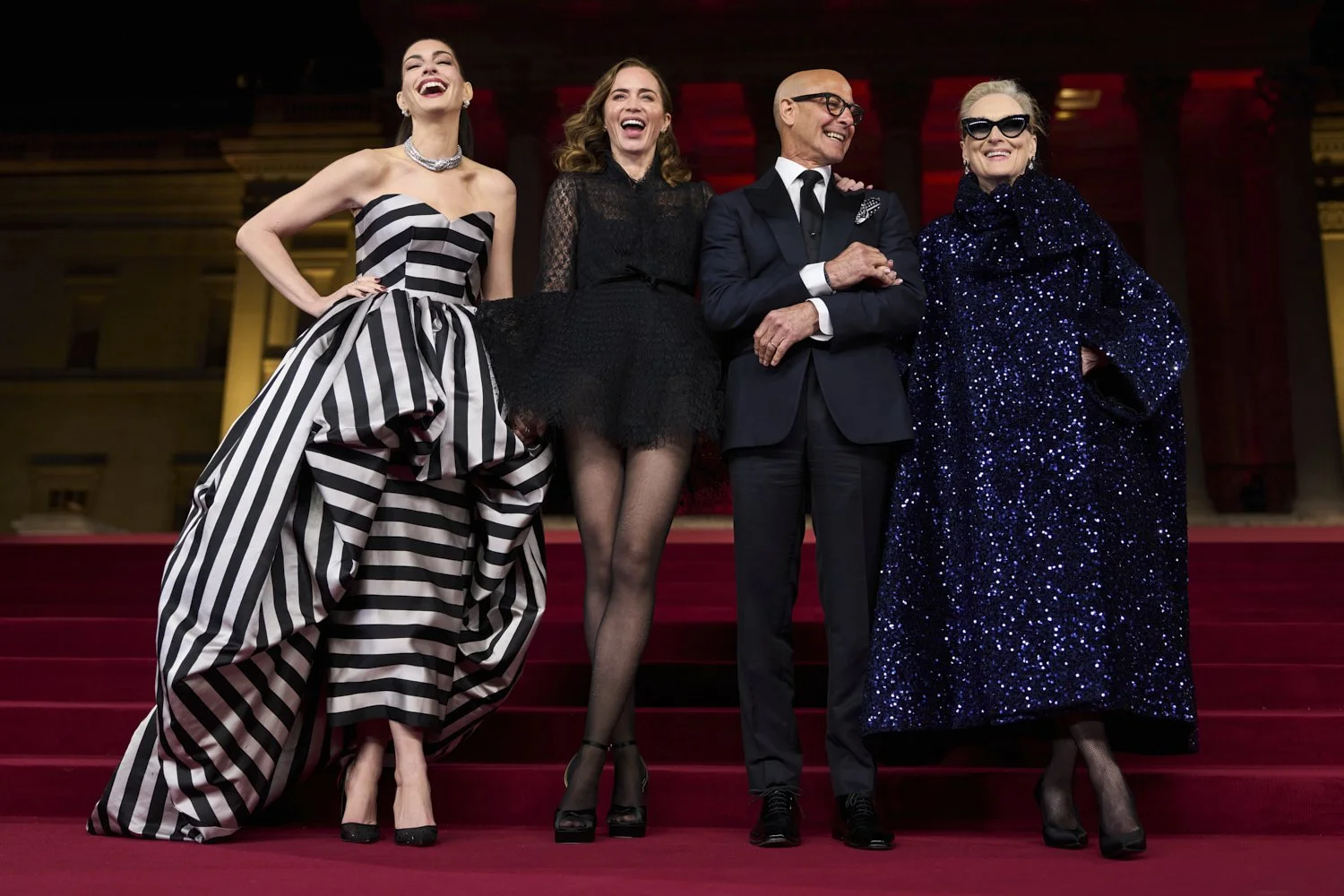  Anne Hathaway, from left, Emily Blunt, Stanley Tucci and Meryl Streep pose for photographers upon their arrival at the 'A Night With Runway: The Devil Wears Prada 2' photo call in London, April 22, 2026. (Photo by Scott A Garfitt/Invision/AP) 