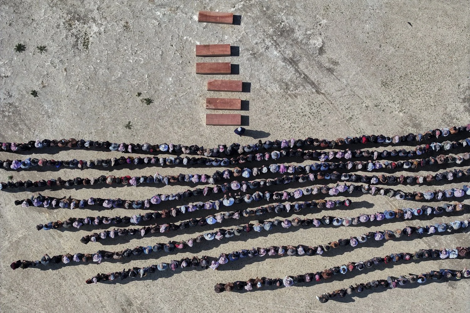  Mourners pray over the six coffins of members of the Al-Jalib family, who were killed in Israeli strikes in Beirut, during their funeral in the al-Sour, Deir al-Zour province, northeastern Syria, April 11, 2026. (AP Photo/Ghaith Alsayed) 