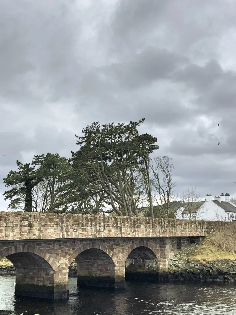 The village’s old bridge, where the River Dun meets the sea