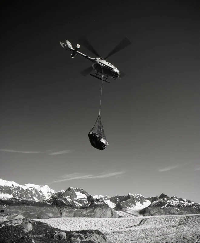 Helicopter pilot Jim Harvey (Air Logistics) moving sling loads at Columbia Glacier, June 2004