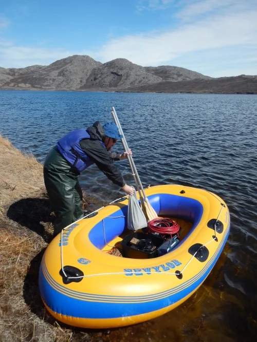 Prepping the inflatable boat before collecting water and diatom samples on a lake in Greenland. University of Maine’s Jasmine Saros and a team of graduate students and post-doctorate students are in Greenland this summer investigating diatom assemblages for clues on how climate change may impact Arctic lakes. Photo: Jasmine Saros.