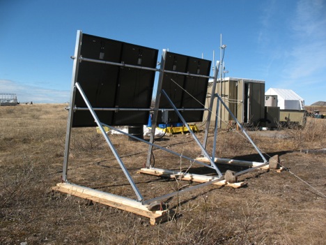 The back of the new PV array showing additional bracing and tie downs. The array is set at a steep 80 degree angle to maximize power production in the shoulder seasons. The black color and angle should minimize snow accumulation. The bottom of the panels is located 40” above grade to prevent being buried in snow drift. All of this produces a significant sail effect, so it is important to hold it down well. We use a combination of pinning with re-bar, ballast and guy cables. Two more side guys are yet to be installed.
