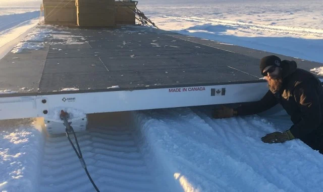 GrIT Operator Ben Toth showing Smobile sled's low clearance.