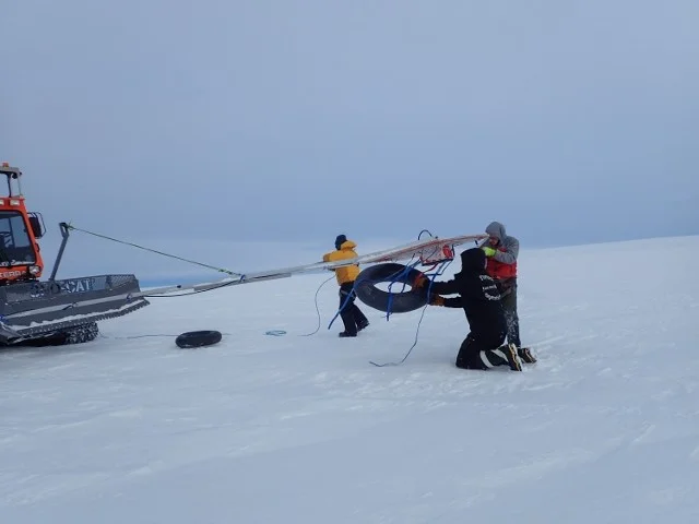 SCAT team adjusting GPR boom – mounted on an arm in front of the Tucker, it is our first method of crevasse detection. Photo: Robin Davies