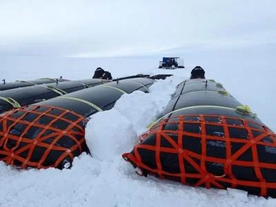 Snowballs accumulating on the fuel bladders. Photo: Robin Davies