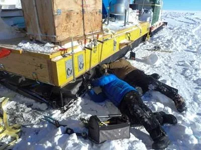 Crew members working to re-fasten the pouches to the decks. Photo: Robin Davies