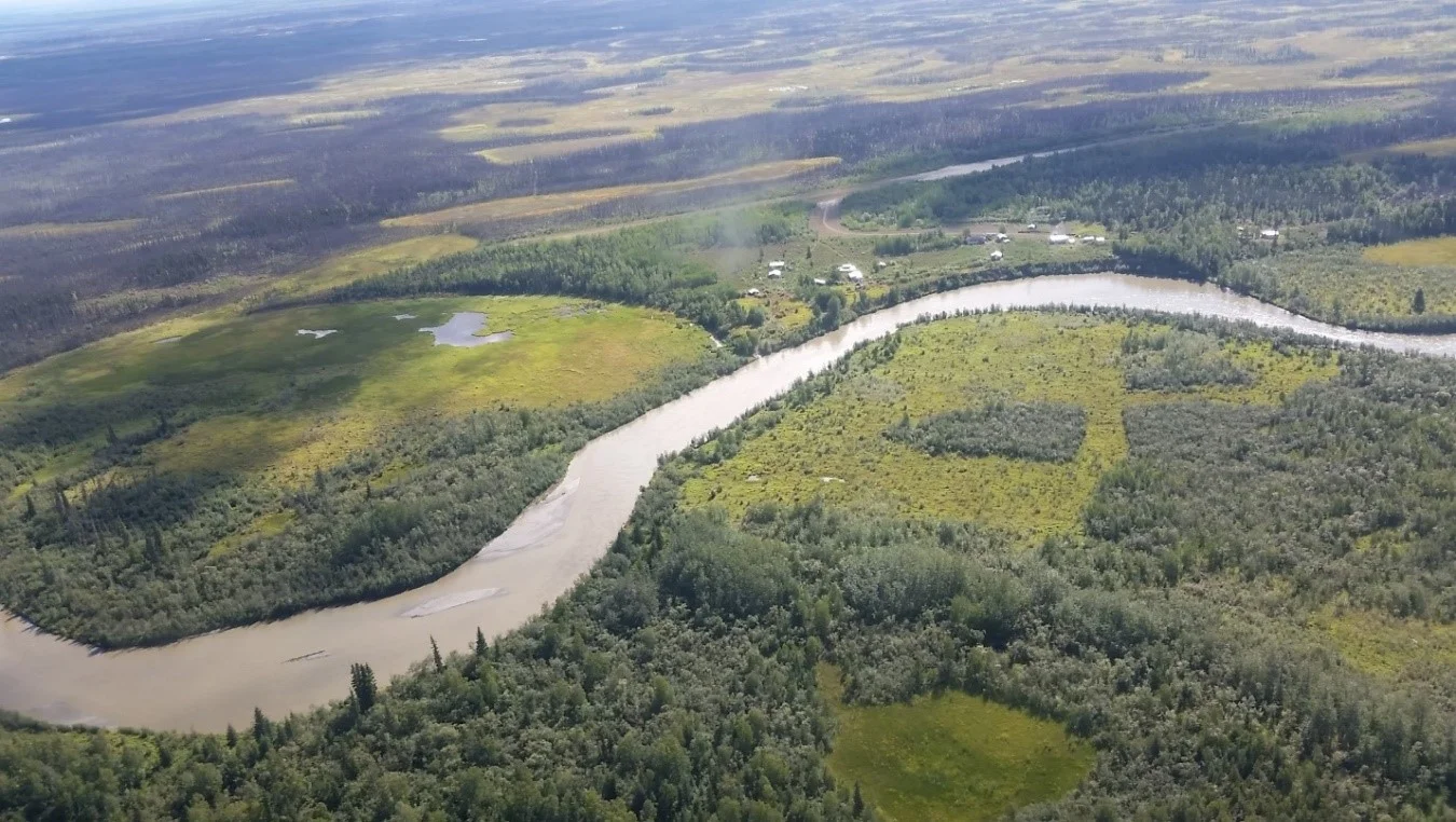 Aerial view of the Upper Kuskokwim River, with the community of Telida Village visible in the distance. Photo credit: Permafrost Laboratory.