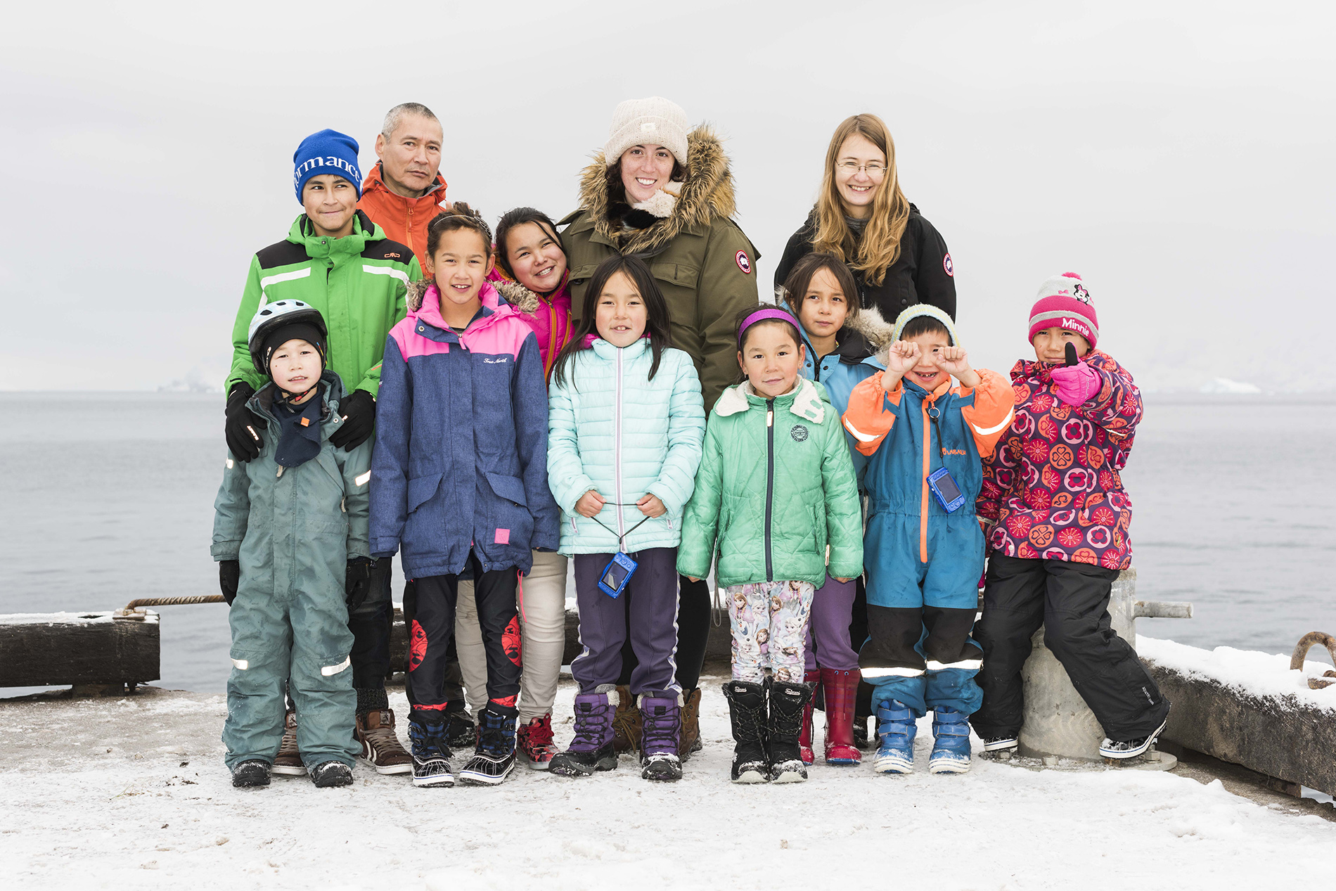 Group portrait in Illorsuit of kids in the photo workshop. From row: Uiloriaq M. Jerimiassen, Majka Qvist, Mona Korneliussen, Francis Korneliussen, Frederik Malakiassen and Najannguaq Malakiassen. Back row: Steffen Jerimiassen-Motzfeld, Axel Jerimiassen, Angerlannguaq Korneliussen, Kyra Kryniski, Tonja Korneliussen and Susan Vanek. Photo credit: Denis Defibaugh.