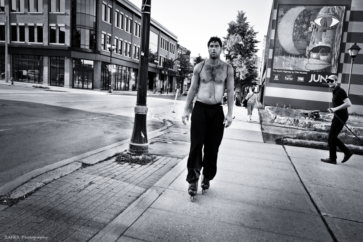 shirtless man on skates James North 1 sm.png