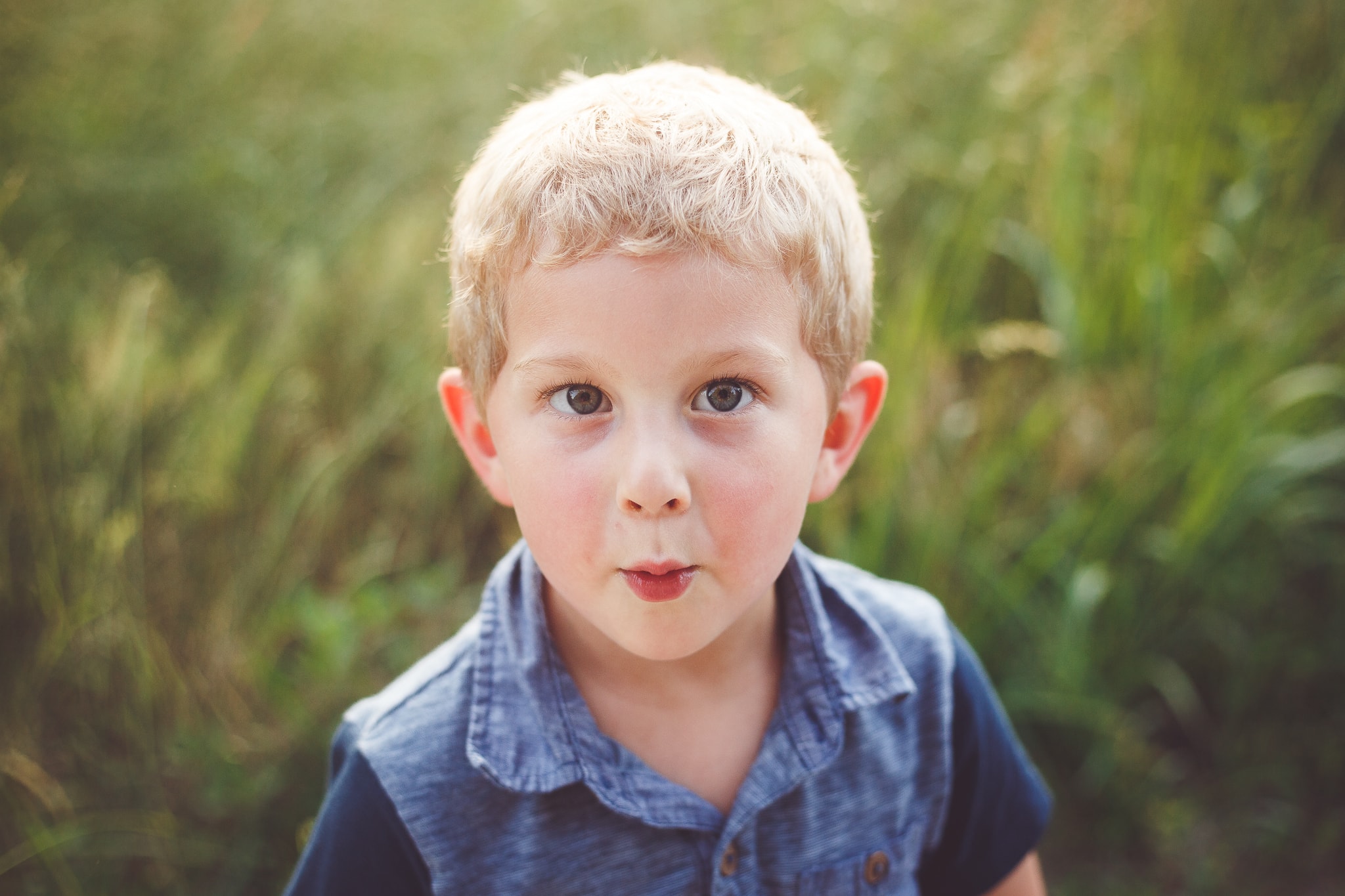 A young boy makes a playful face for the camera - Child Photography Session by L+R Photography - Tulsa, Oklahoma