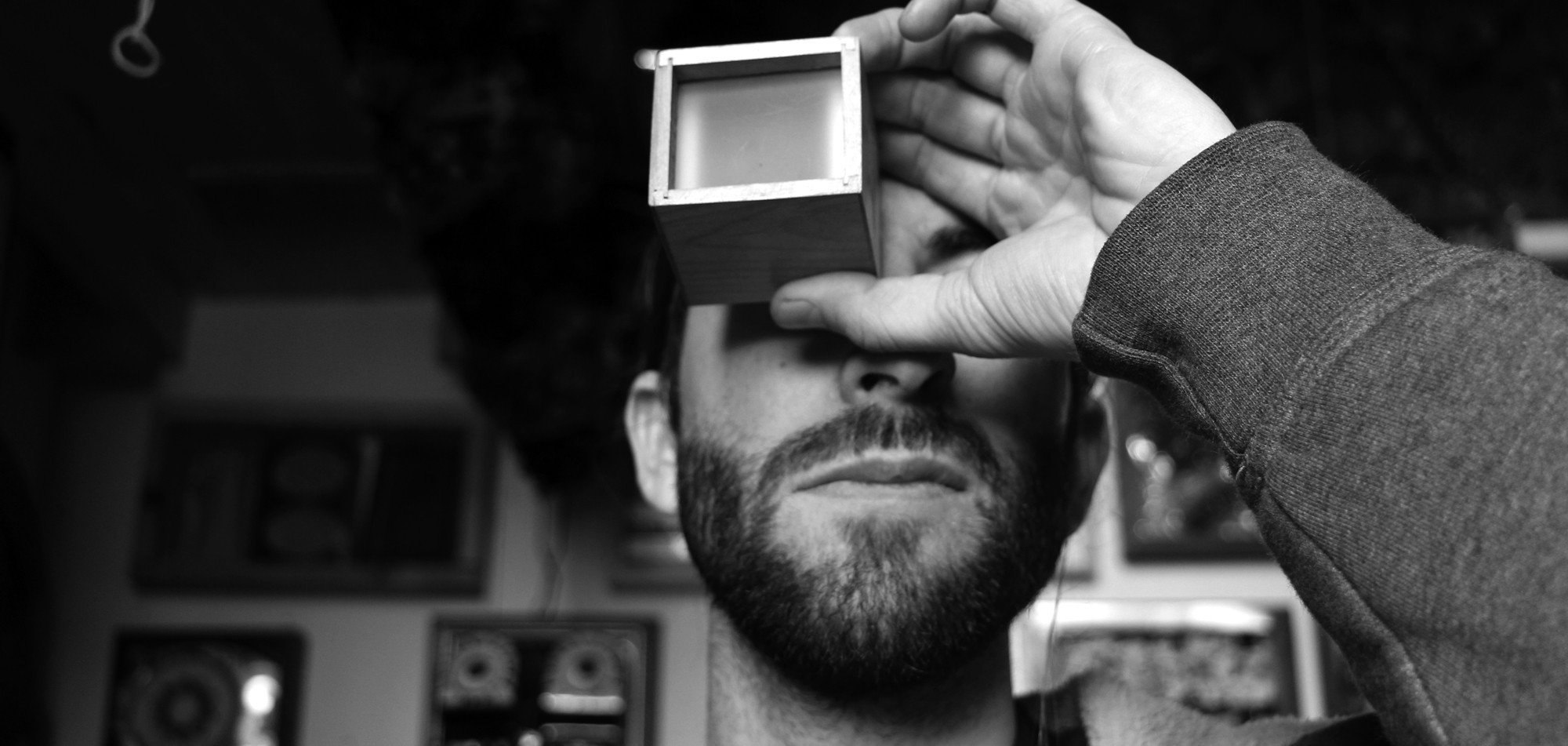 Ian demonstrating his Strange Histories slide viewer during a studio visit with Fiercely Curious.
