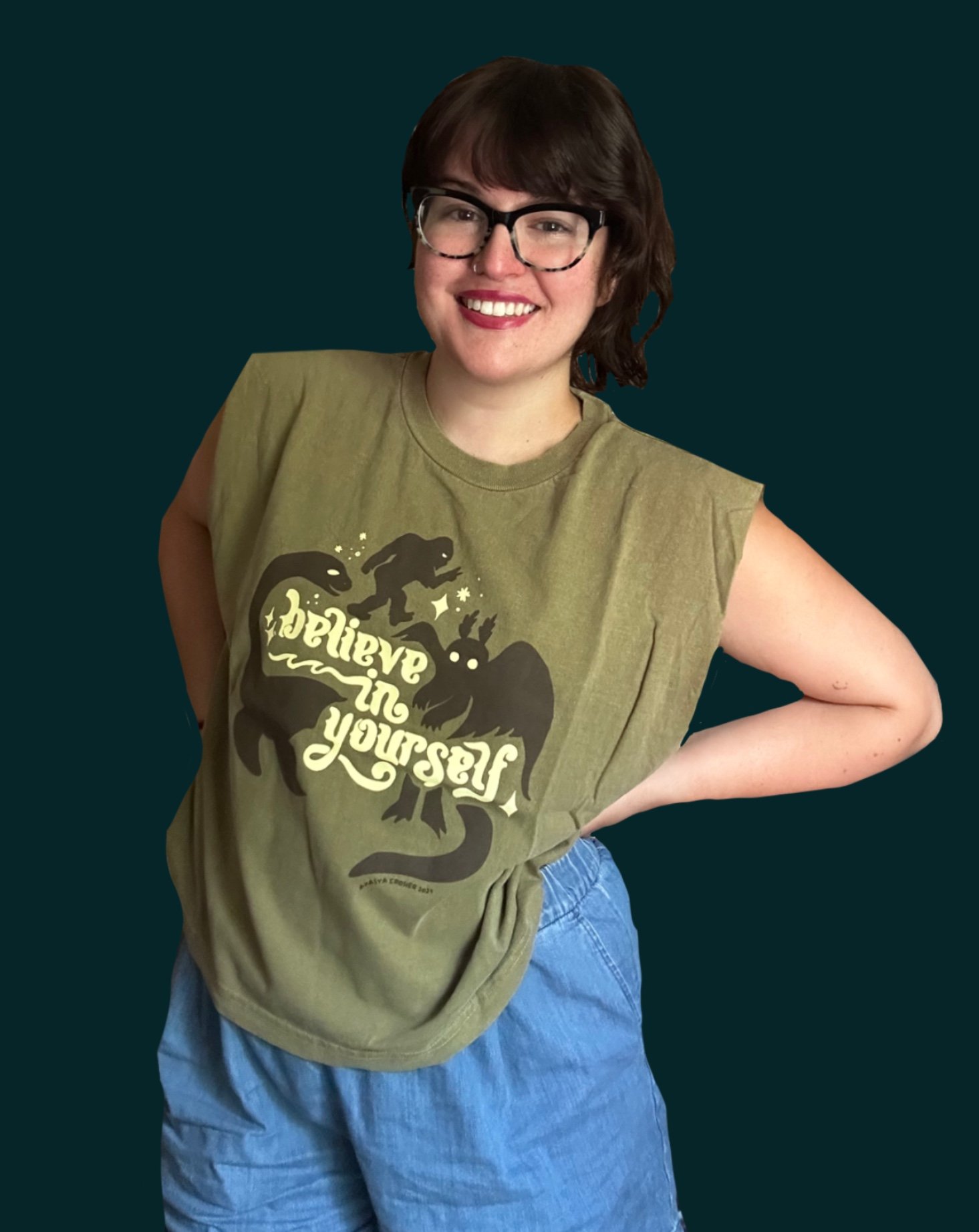 Believe in Yourself Olive Muscle Tank on Model teal bg.JPG