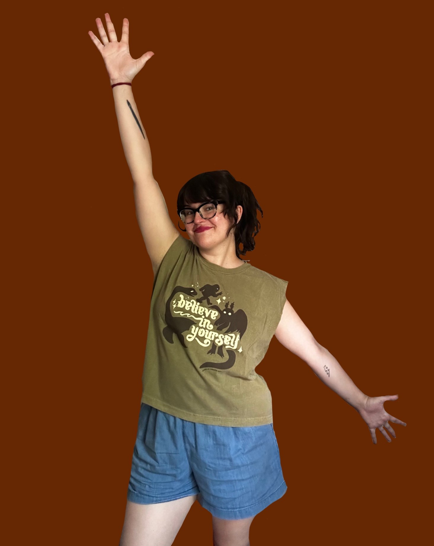 Believe in Yourself Olive Muscle Tank on Model rust bg.JPG