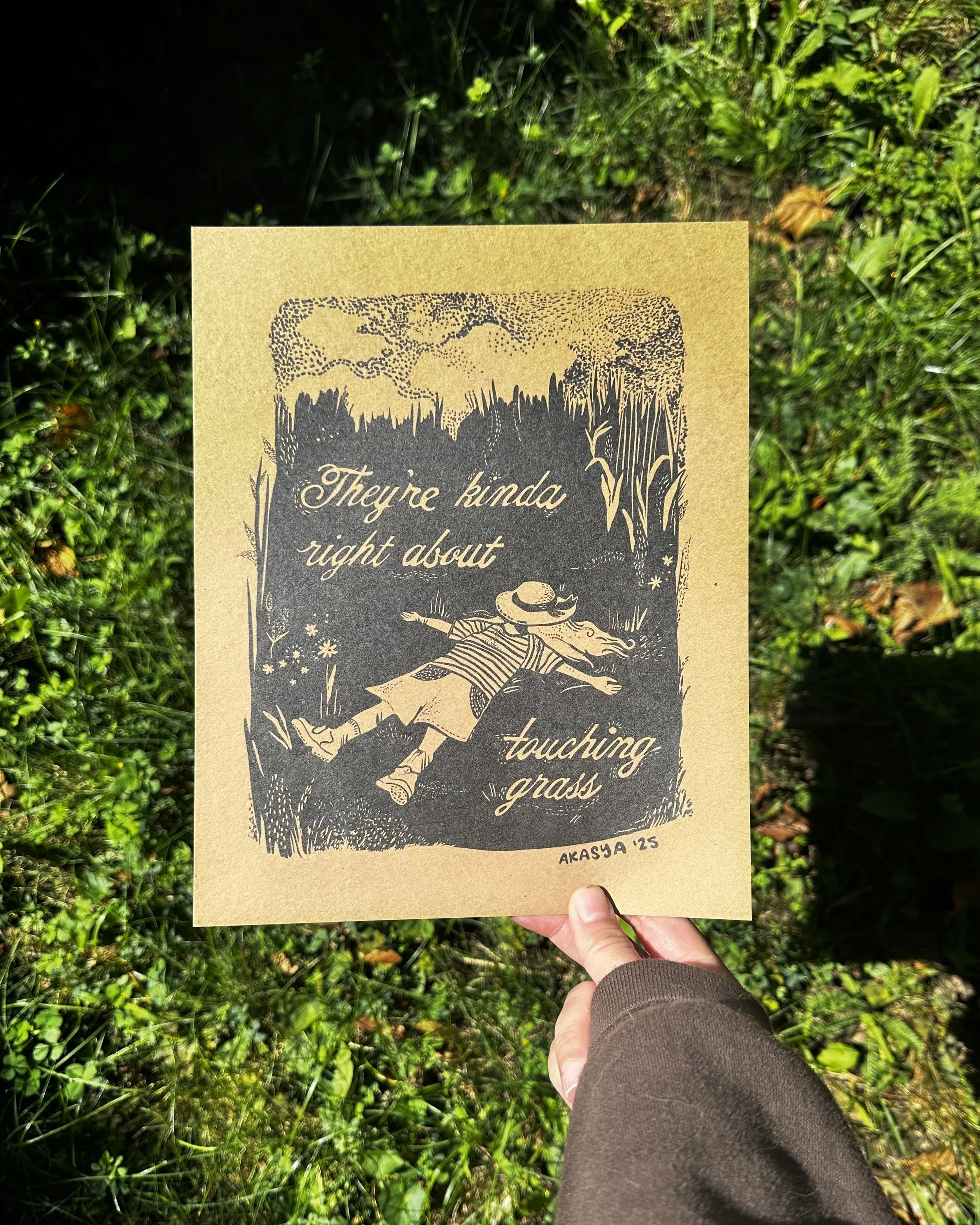 Touch grass orint in hand.jpg