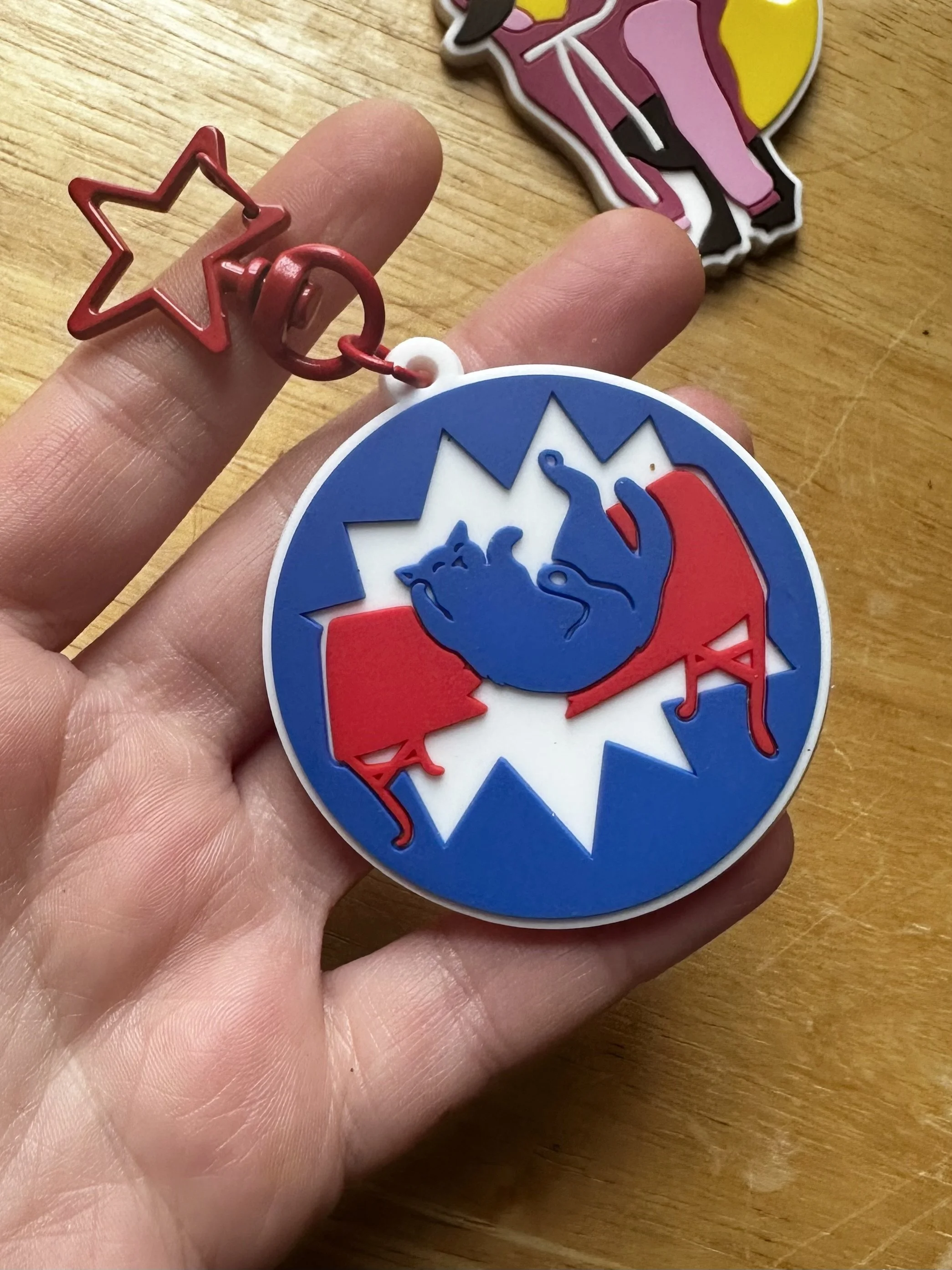 Meowfia keychain in hand.jpg