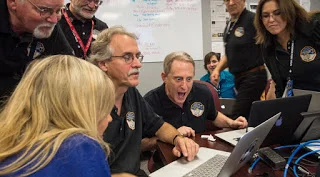 pluto scientists.jpg