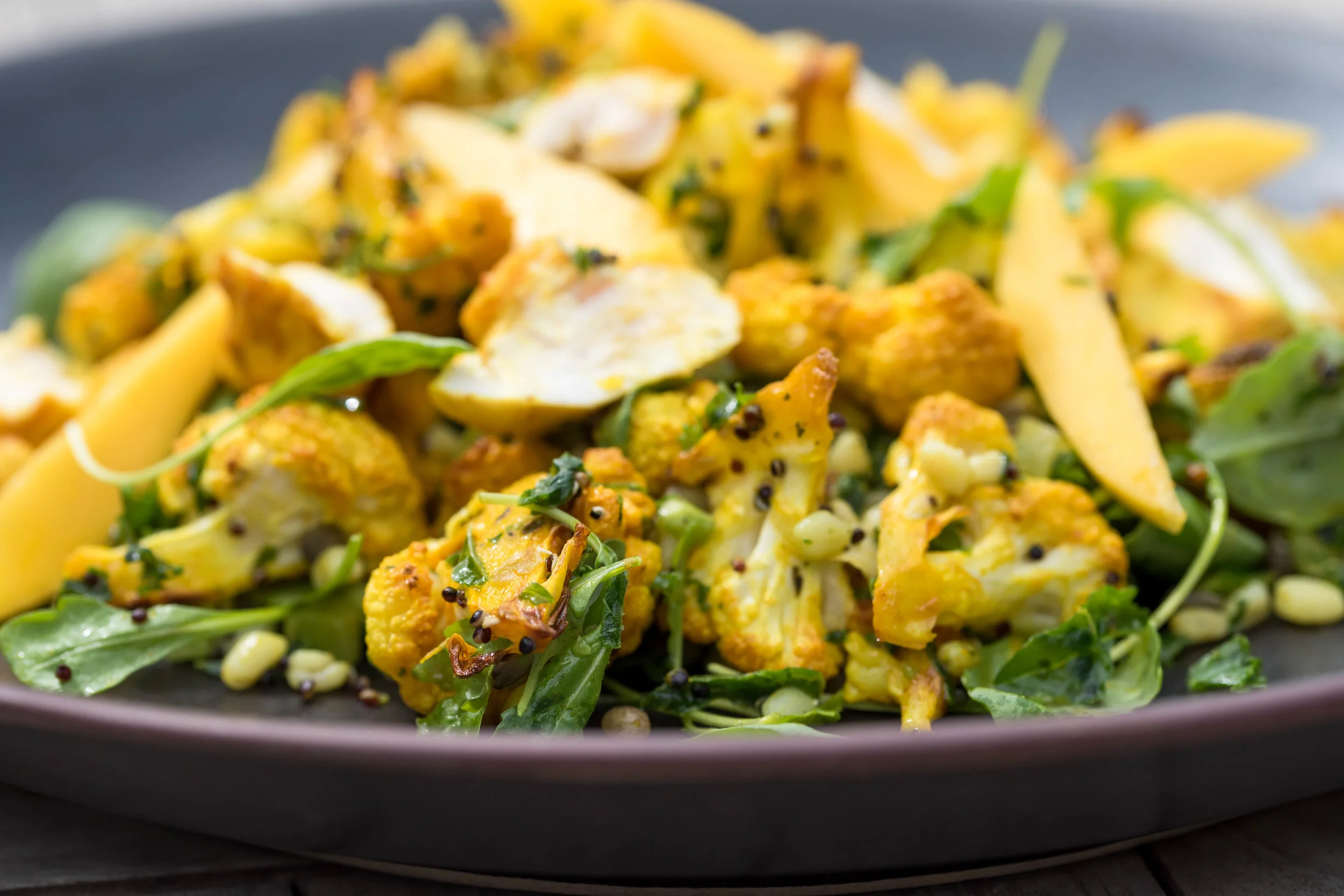 Roasted cauliflower, chicken, mango and lentil salad