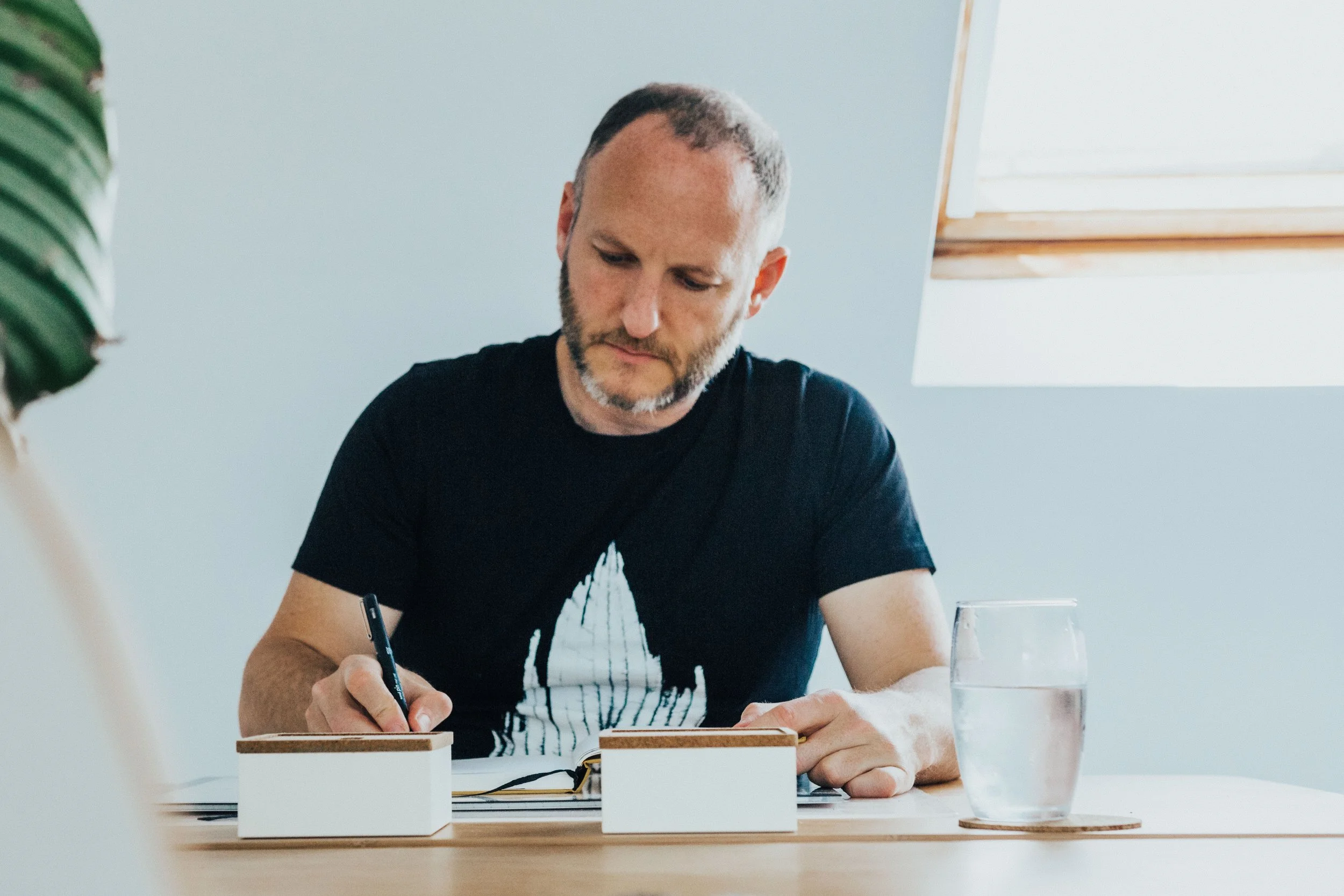 Marc J Francis writes at his studio desk