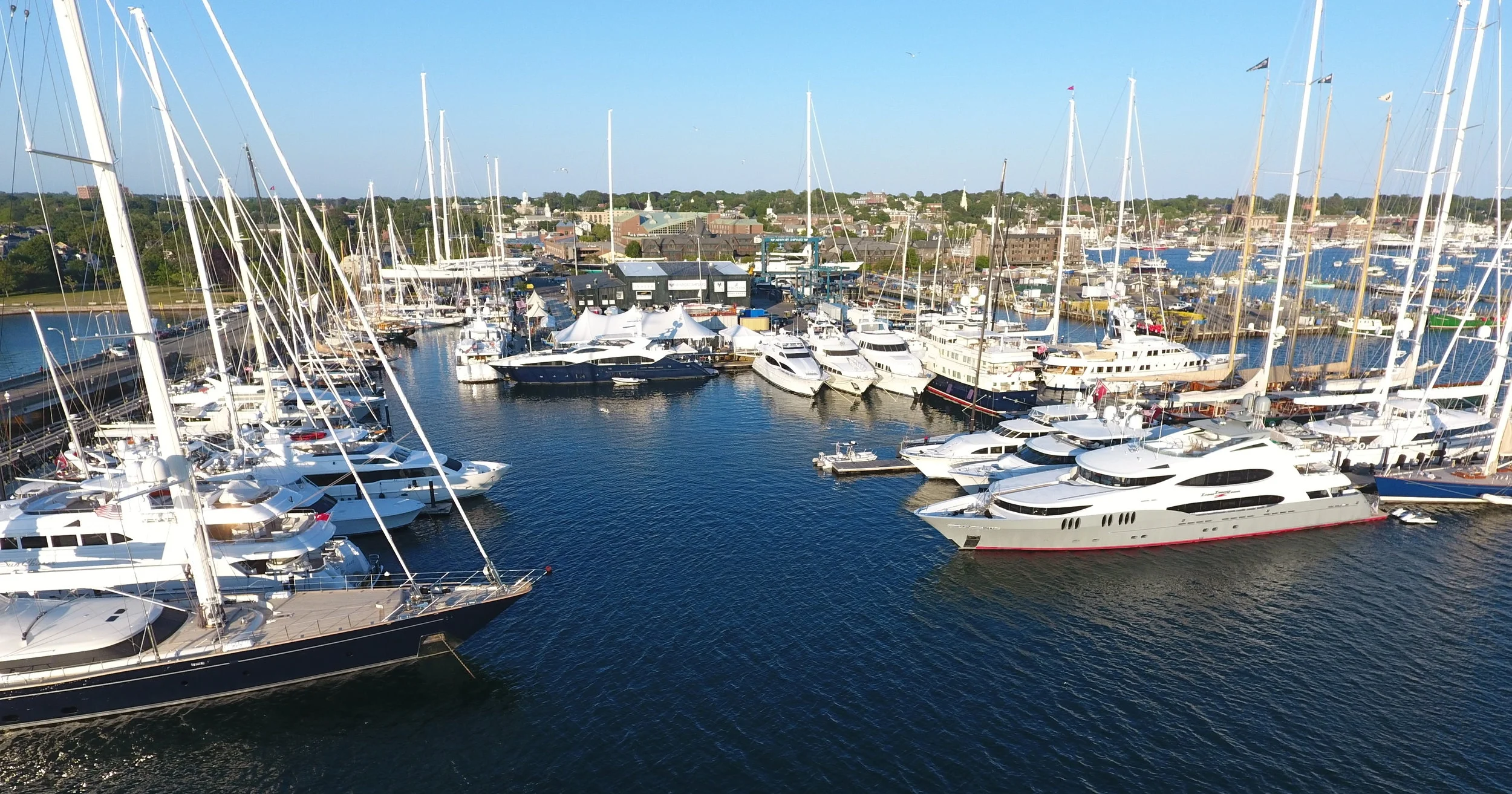 Newport Shipyard, which hosts and services visiting superyachts year-’round, is the home of Newport Charter Yacht Show presented by Helly Hansen. (photo by Billy Black)