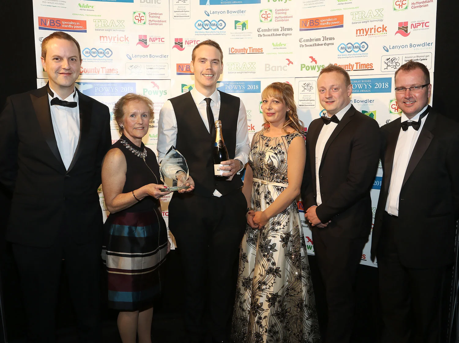 Managing director Mike Cook (left) and the 5C Services team receive the Small Business Growth Award from Nick Jones and Jean Vavere from Myrick Training.