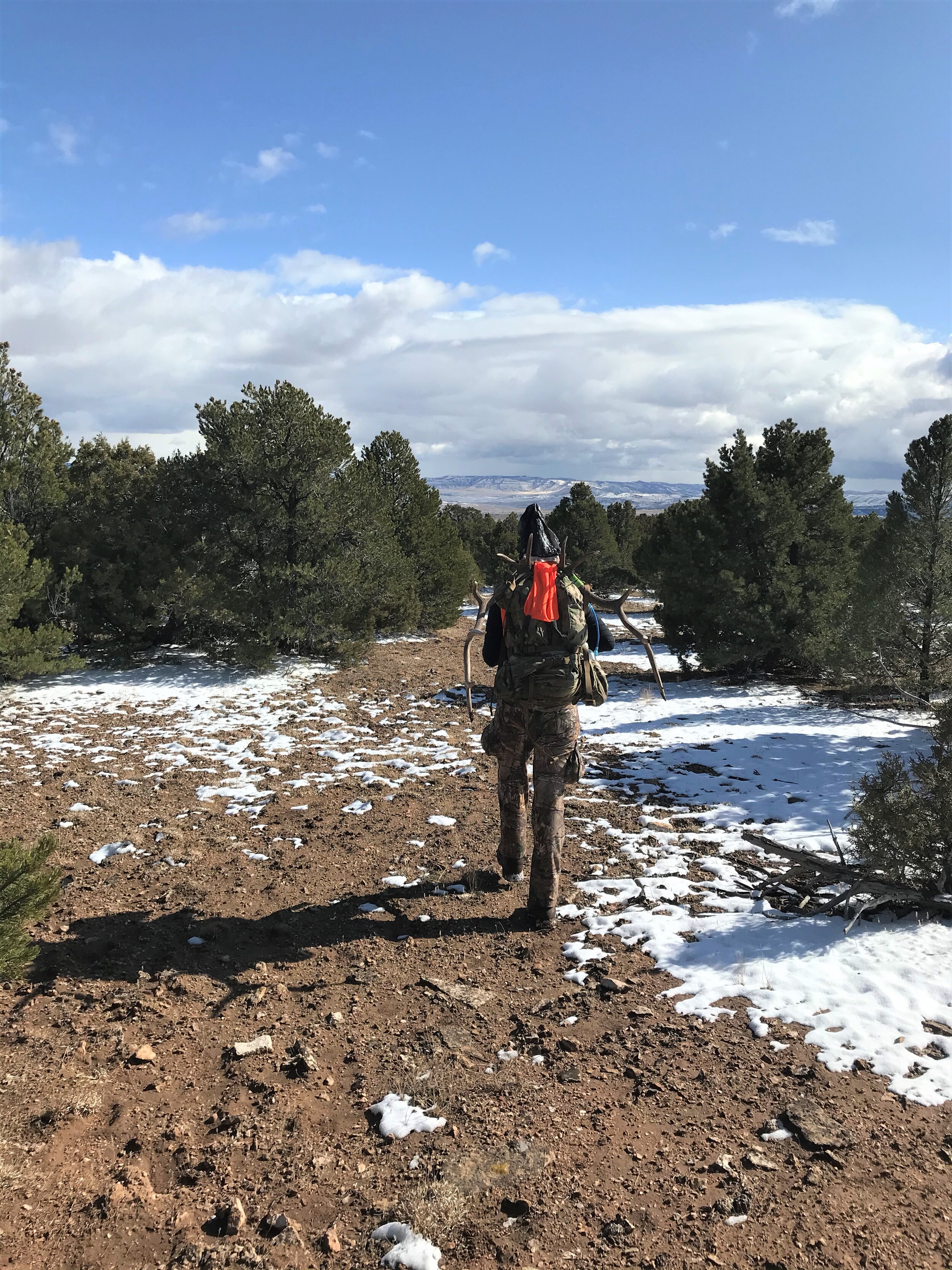 Damian heads down the mountain with a load of meat