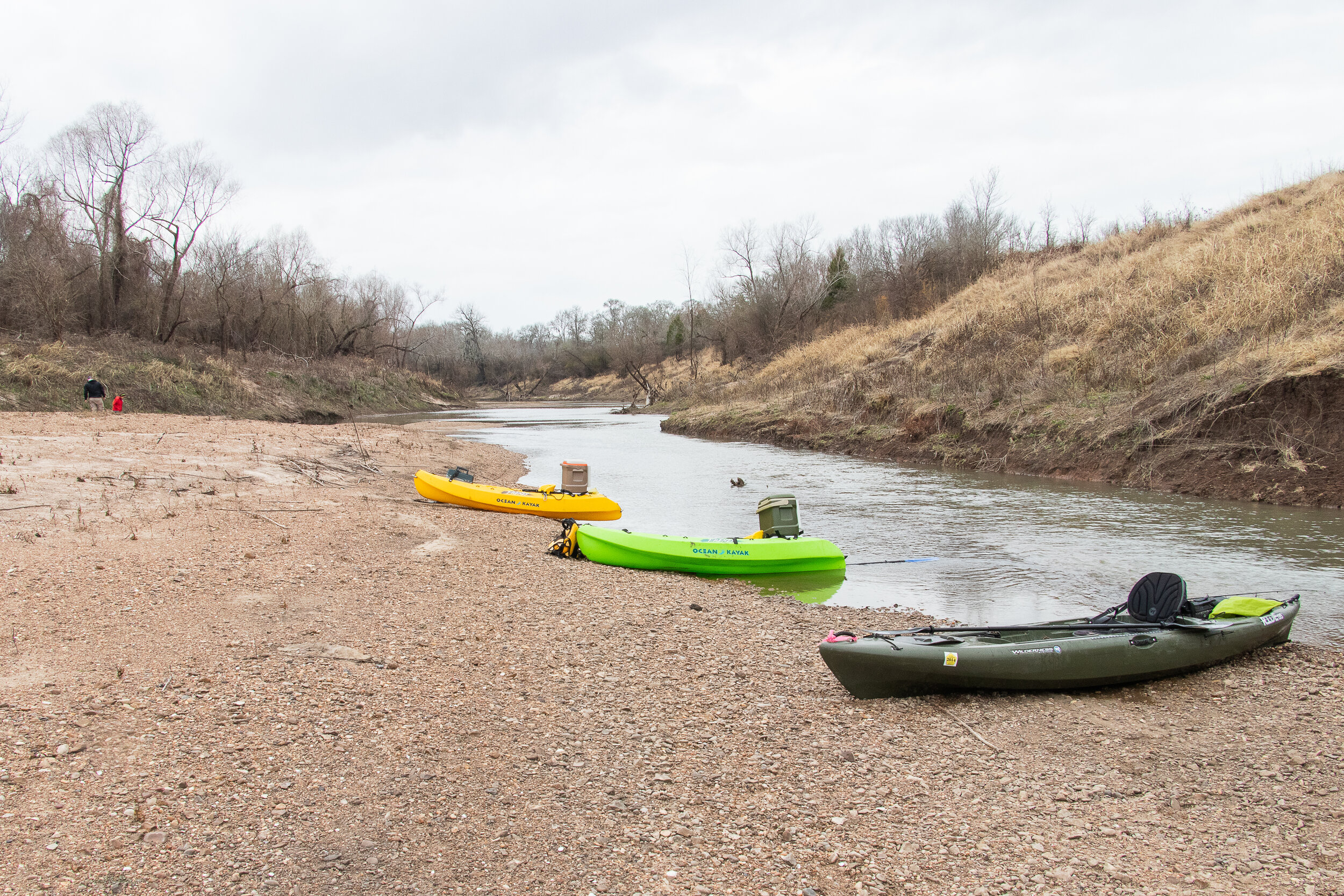 Taking a break along a gravel bar while floating a tributary to the Brazos River.