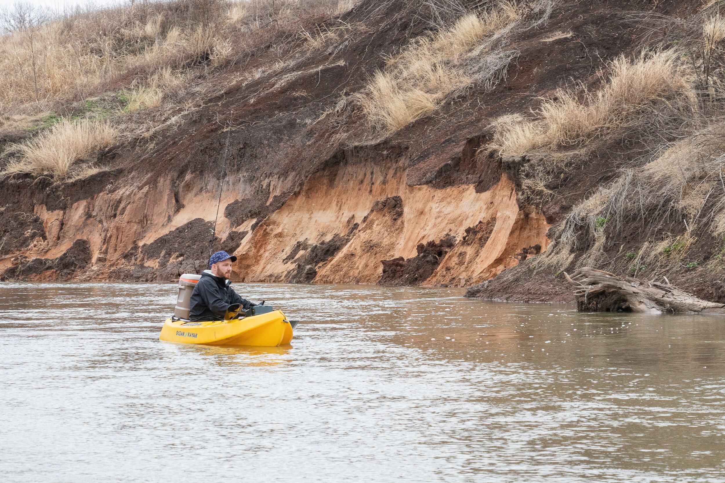 Kyle Hampton floats along, enjoying the sights and sounds of a Texas river.