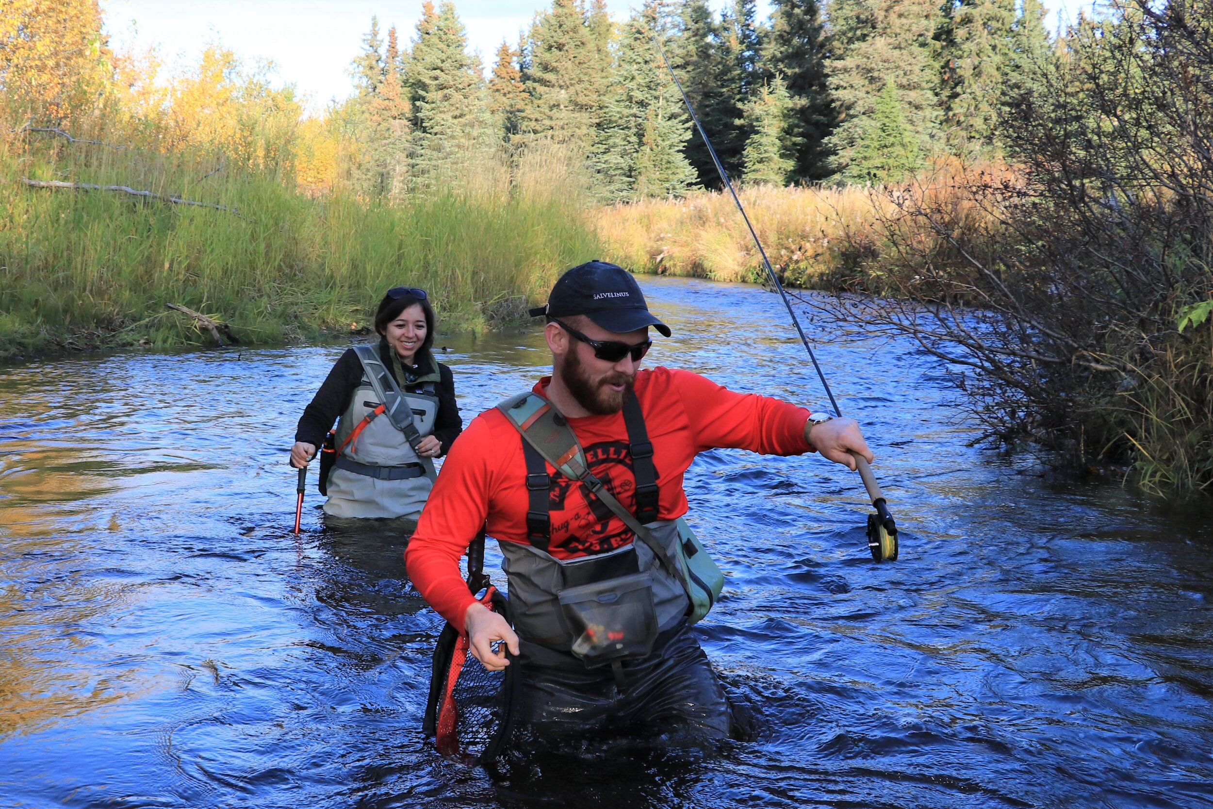  Kyle and Jerissa wading through a small Alaskan stream 