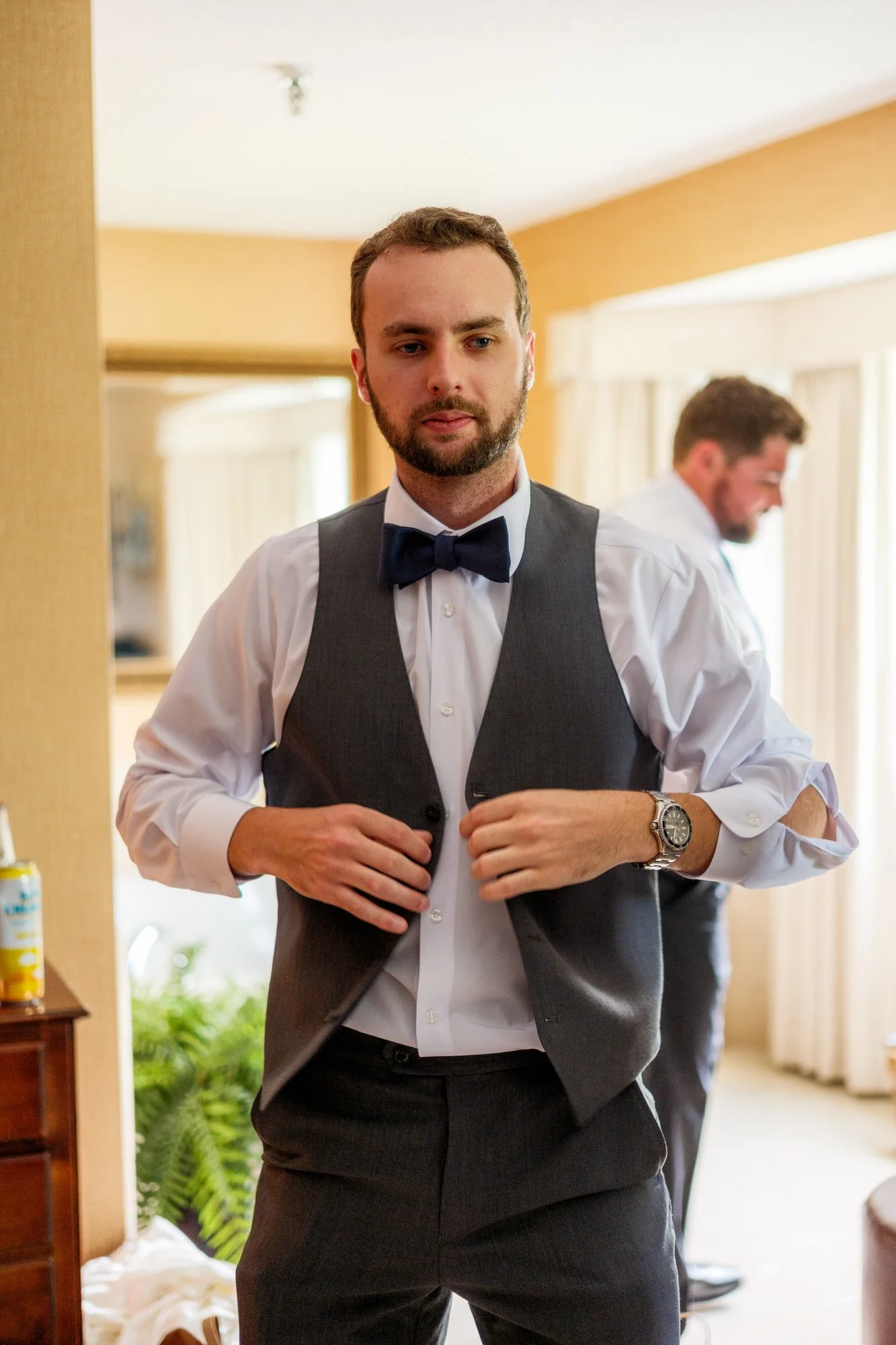 Groom getting ready in tuxedo for a wedding at Lake Morey Resort in Fairlee, Vermont