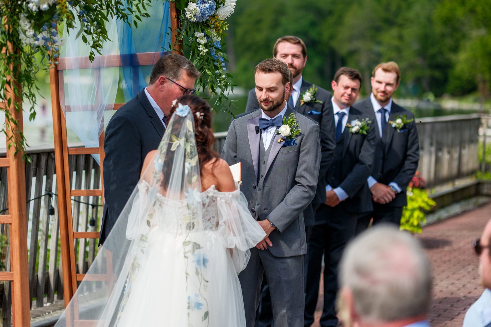 Bride and groom meet at the aisle during a Lake Morey Resort wedding ceremony
