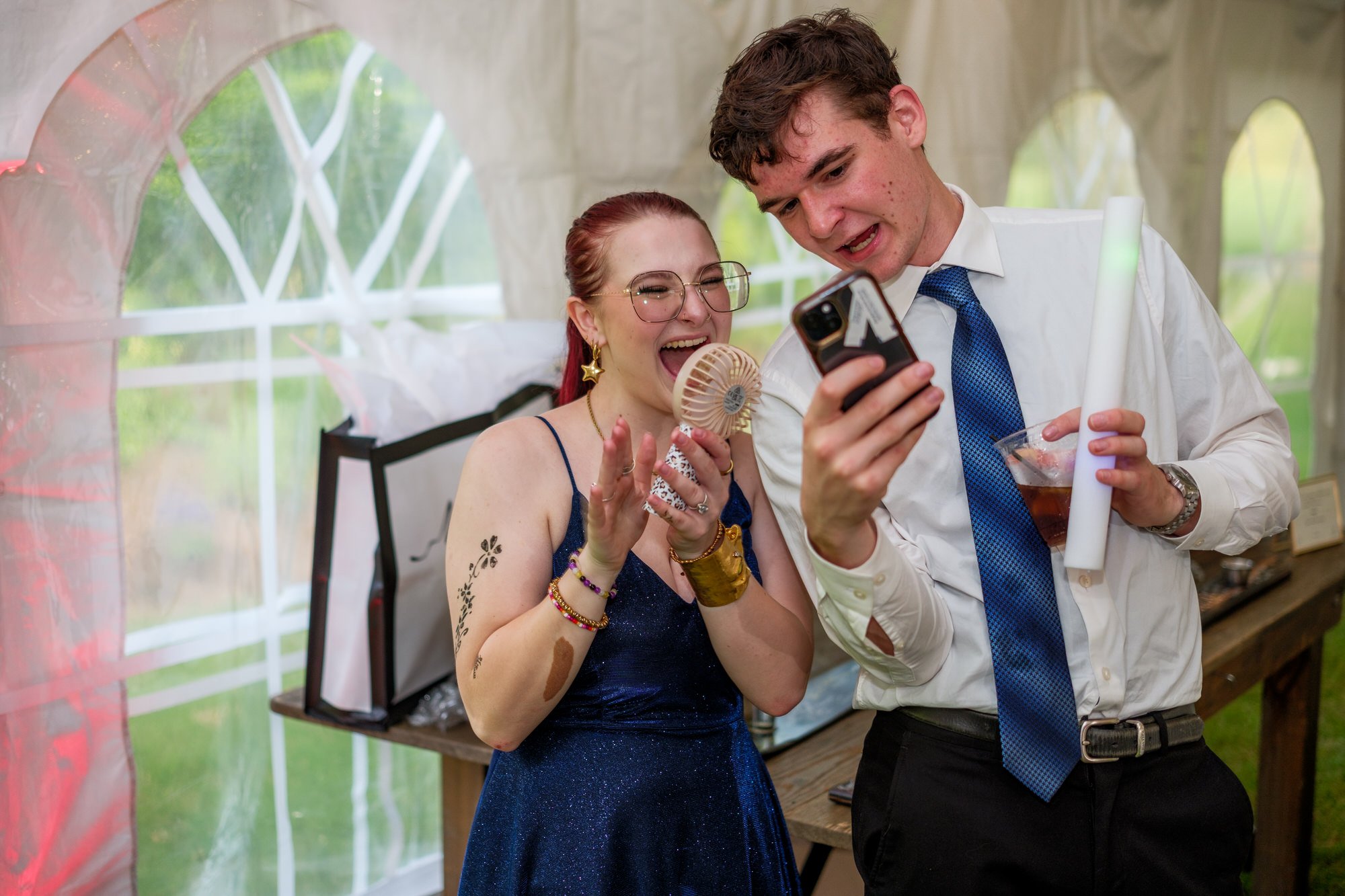Wedding guests share a candid moment at Lake Morey Resort reception