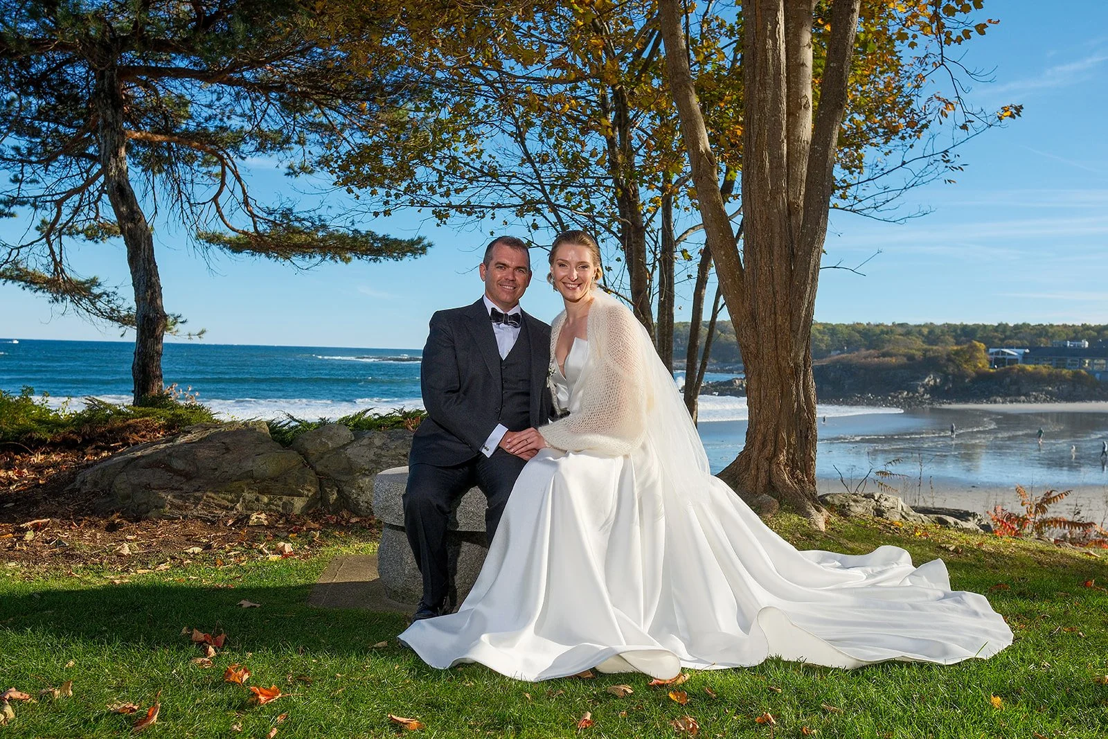 Bride and groom dancing and laughing on oceanside lawn at York Maine fall wedding