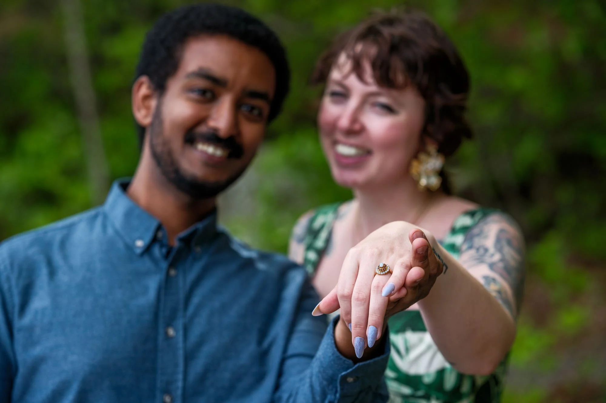 Happy newly engaged couple sharing a close embrace after their proposal
