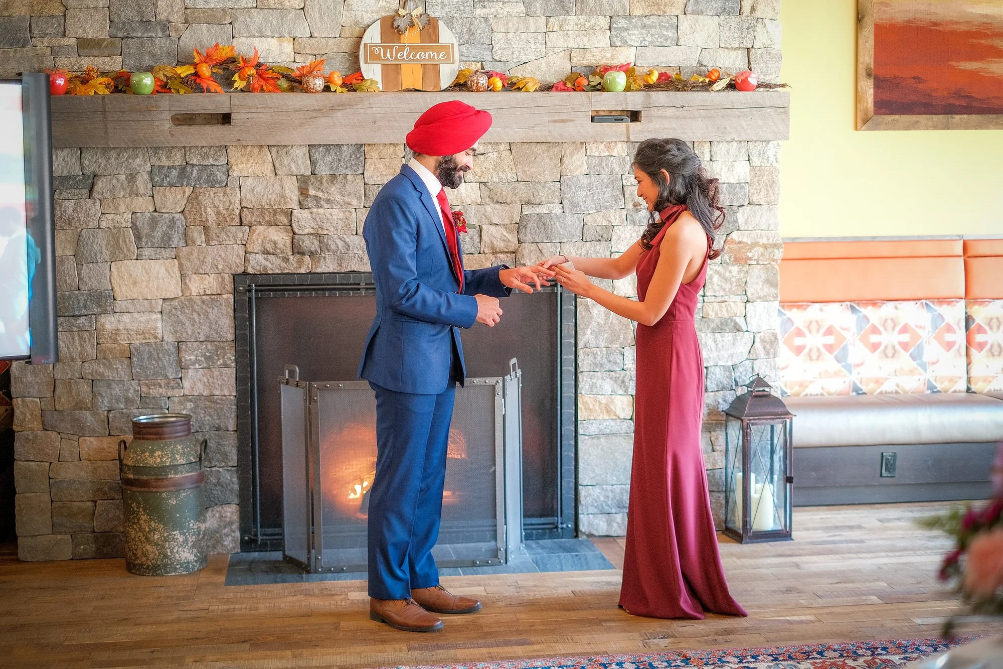 Bride and groom exchanging rings during their January elopement at the Glen House, NH