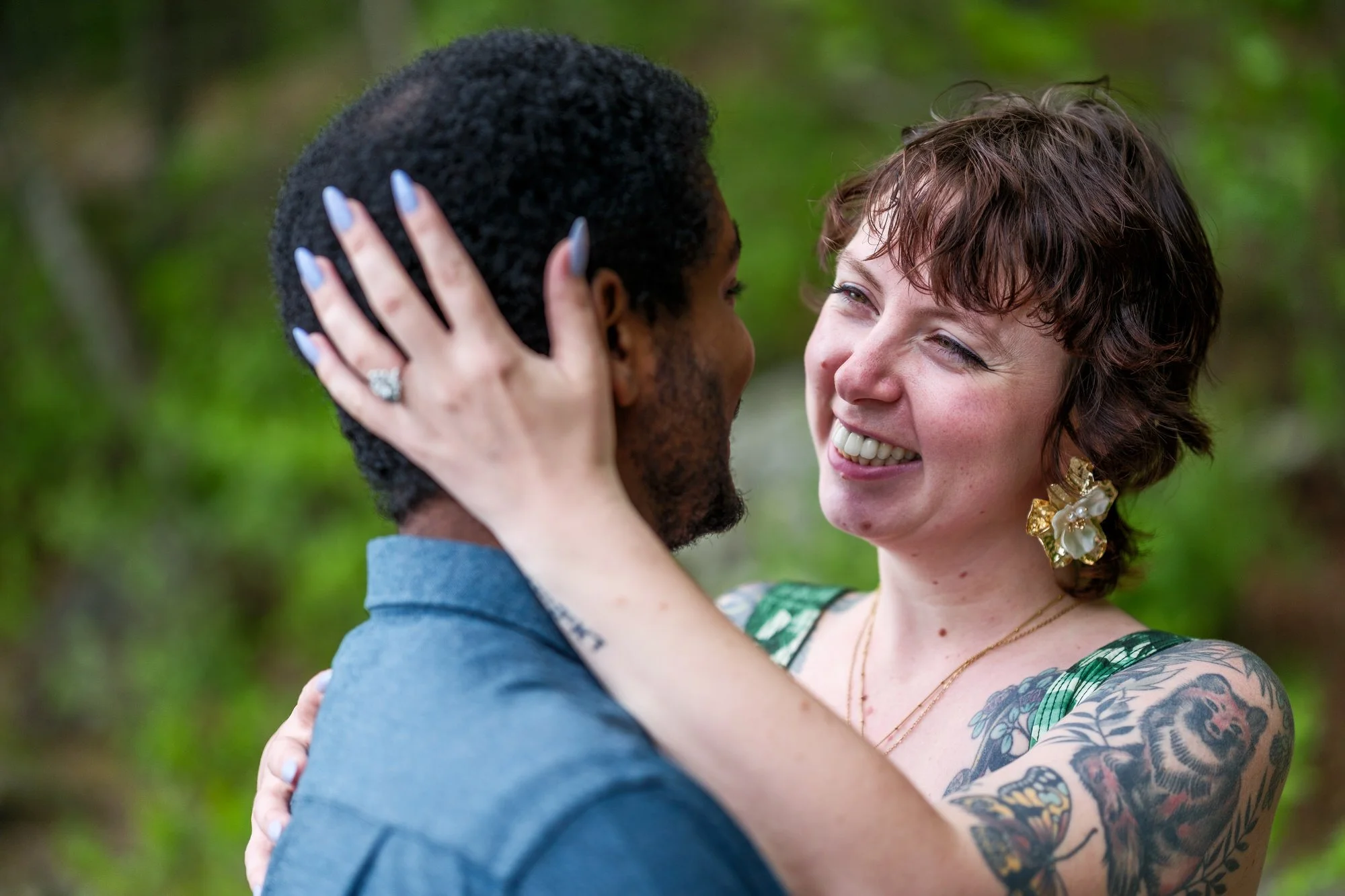 Happy newly engaged couple sharing a close embrace after their proposal