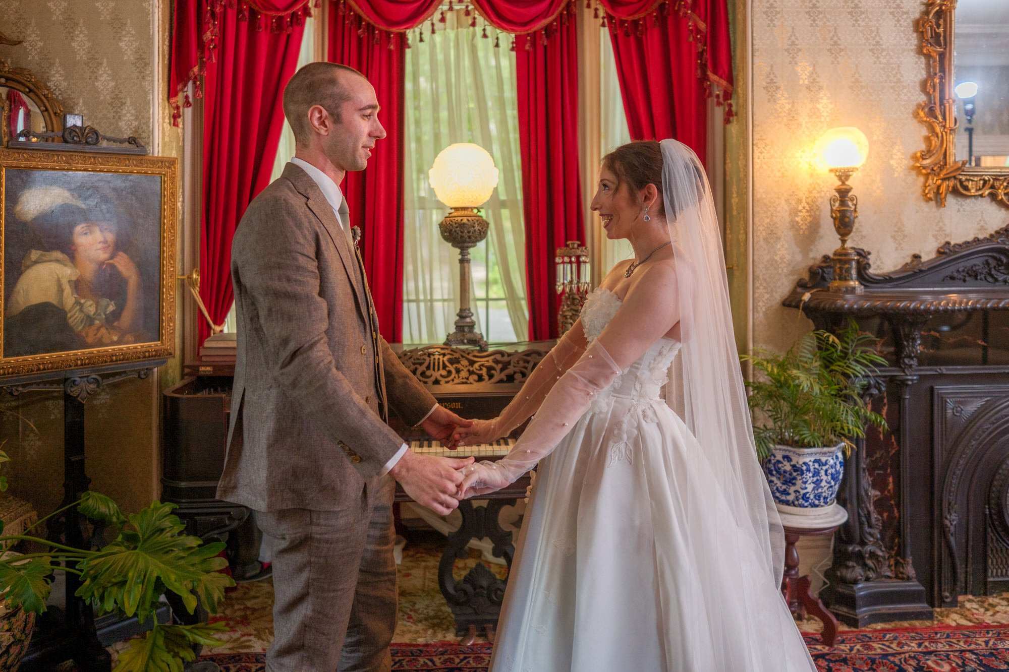 Bride and groom holding hands during their first look