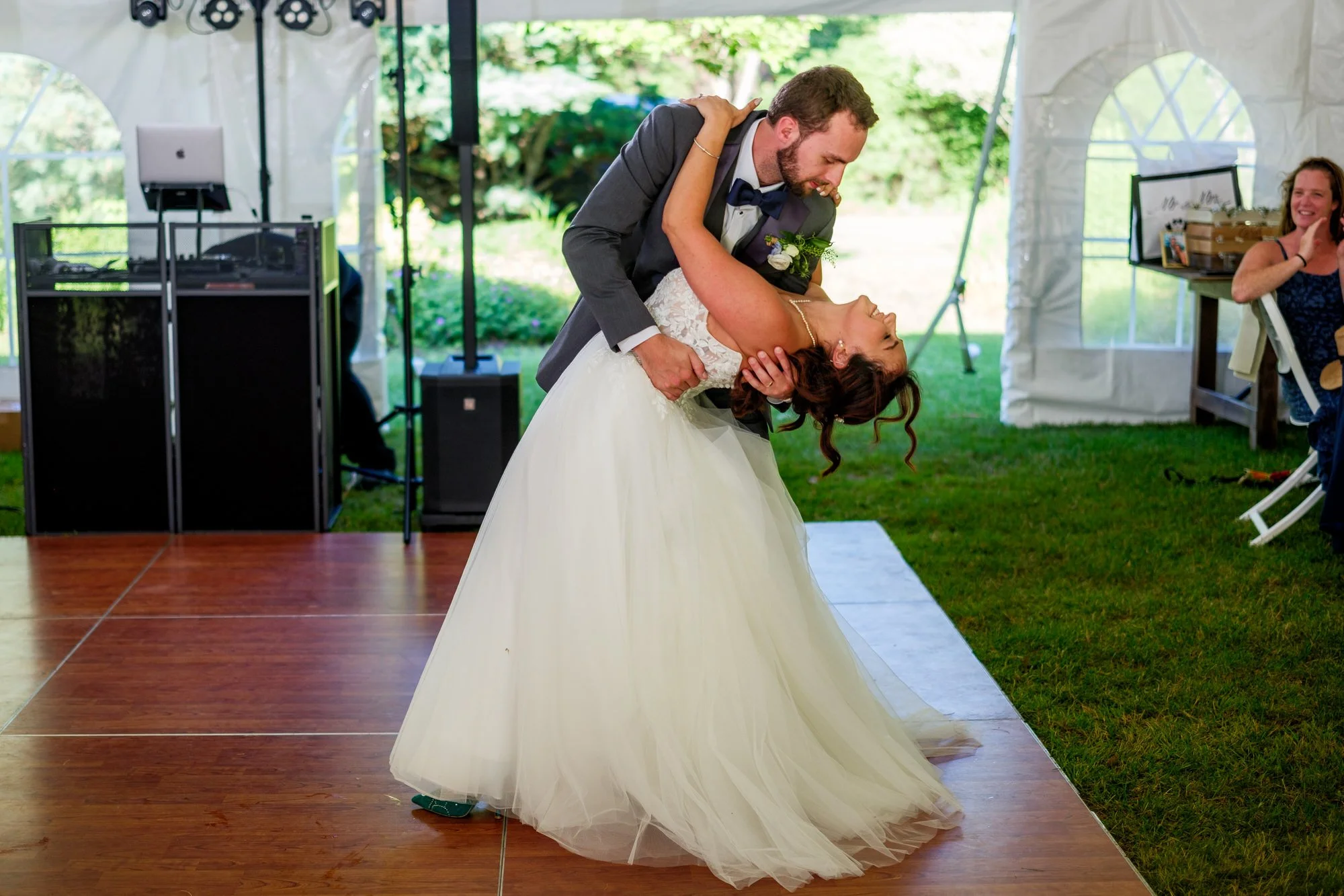 Groom dips bride during first dance at Lake Morey Resort wedding reception
