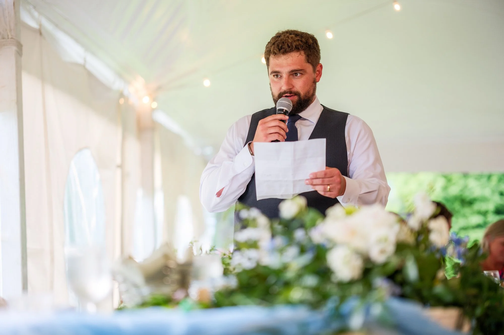 Groom gives reception speech at Lake Morey Resort wedding in Vermont