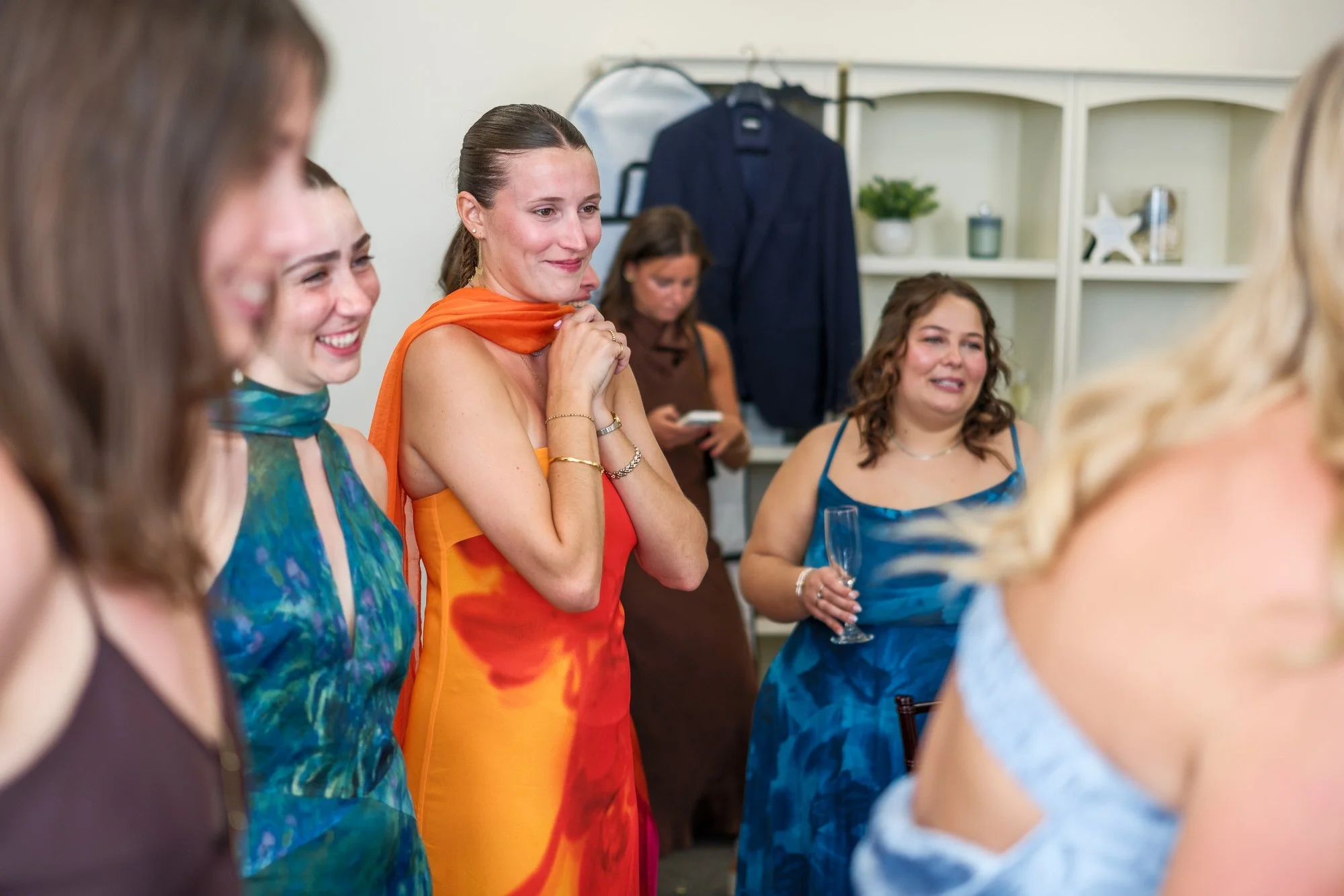 Candid wedding guests laughing during the reception at Blue Ocean Event Center.