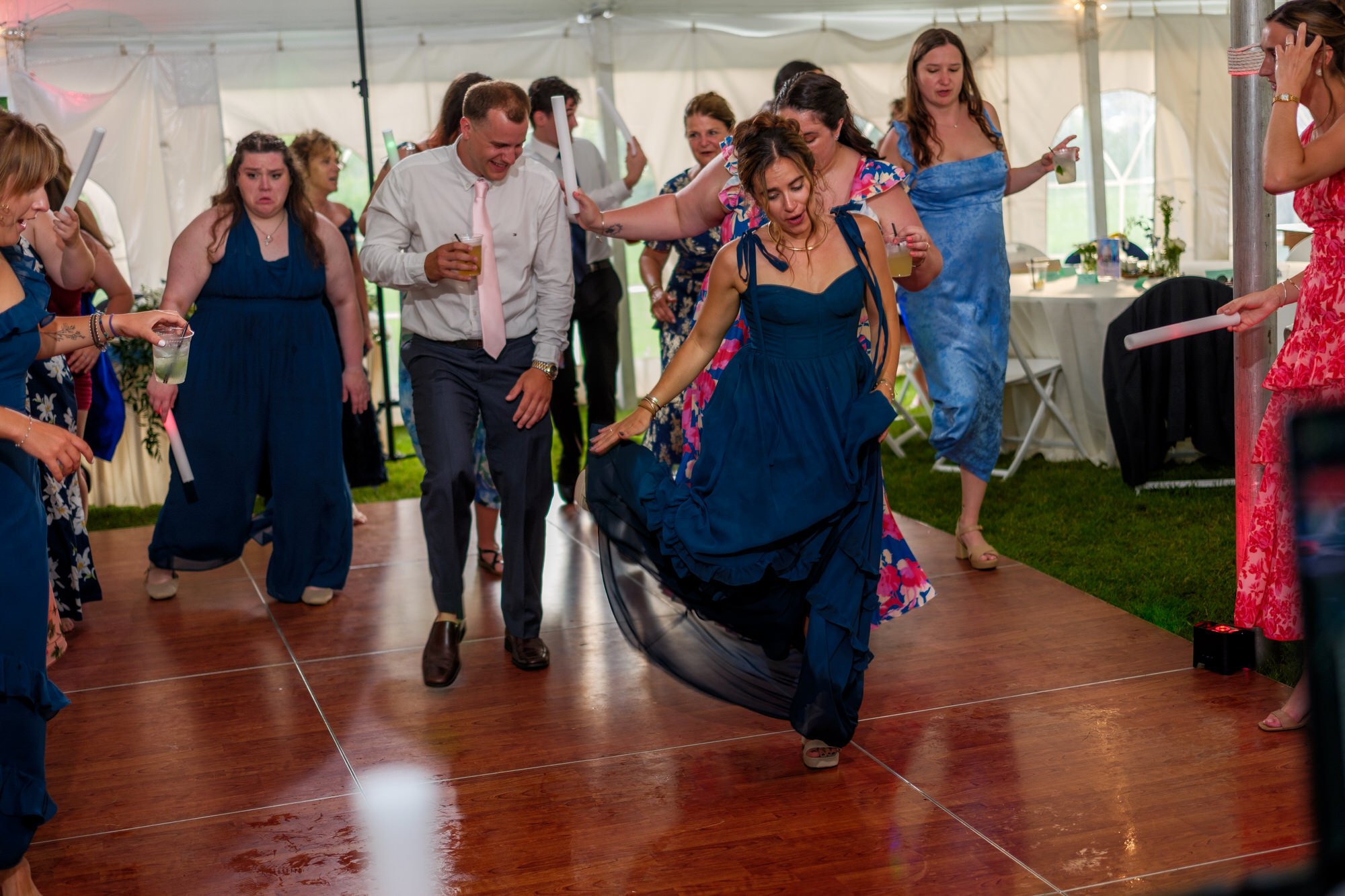 Guests dance with energy during a Lake Morey Resort wedding reception