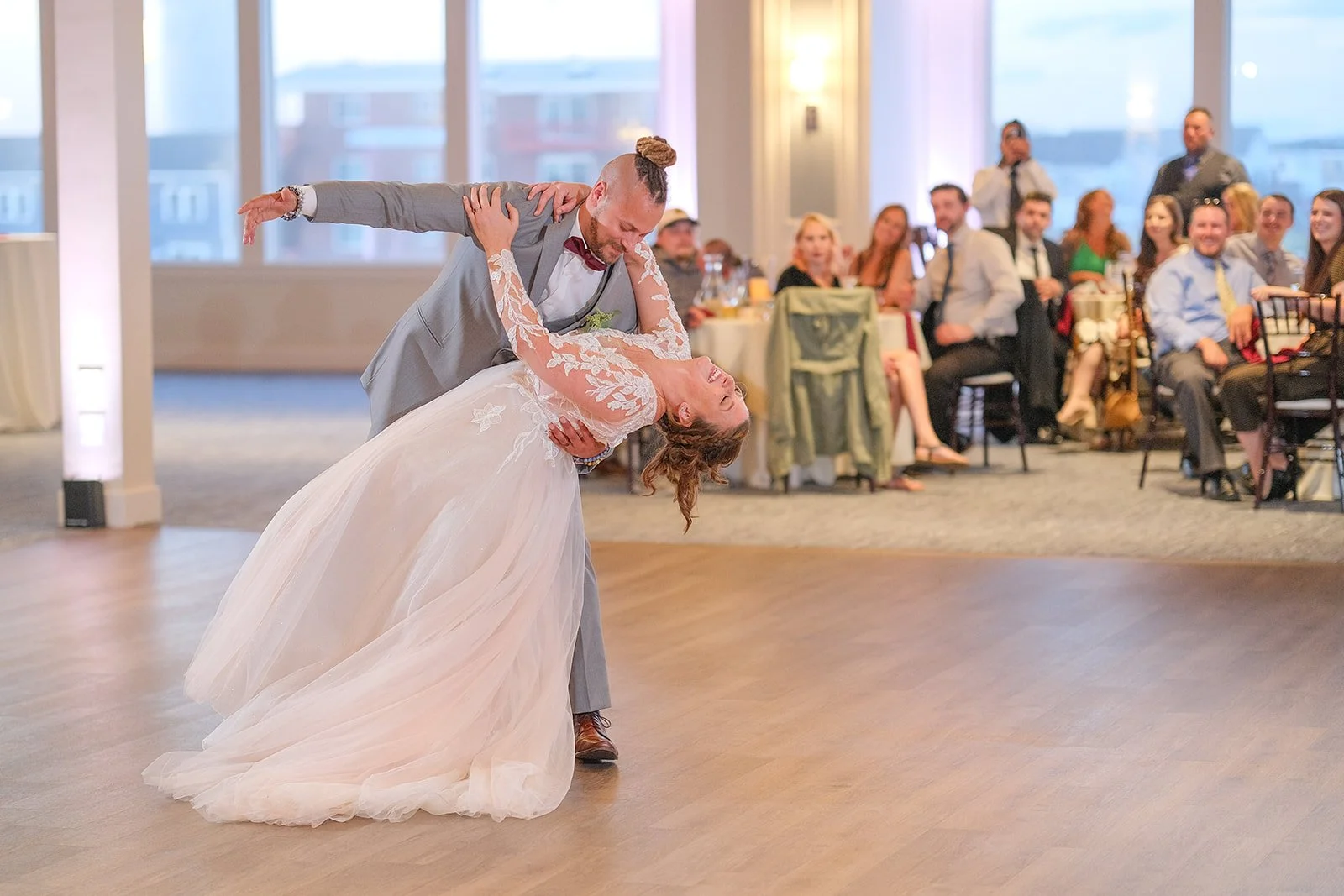 Groom dramatically dipping bride during first dance at Blue Ocean Event Center wedding reception in Salisbury MA