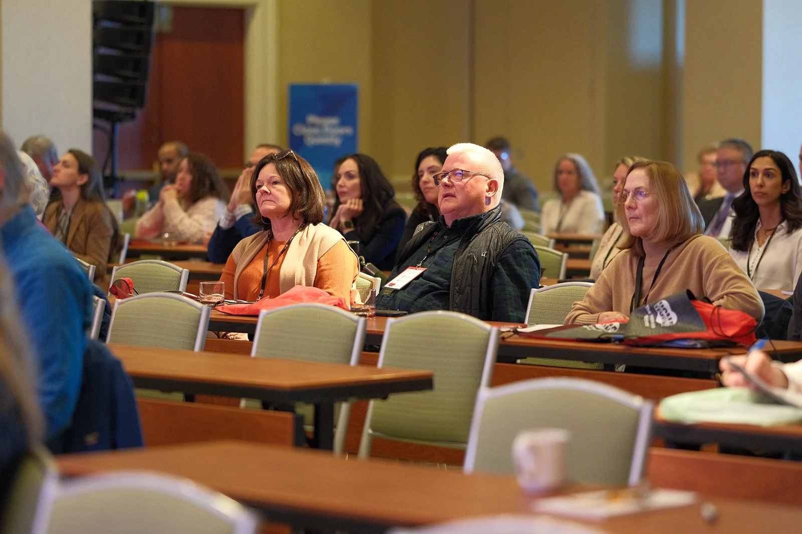 Patients and medical professionals listen intently during a breakout session at the HCMA 2024 Annual Patient Meeting in Boston