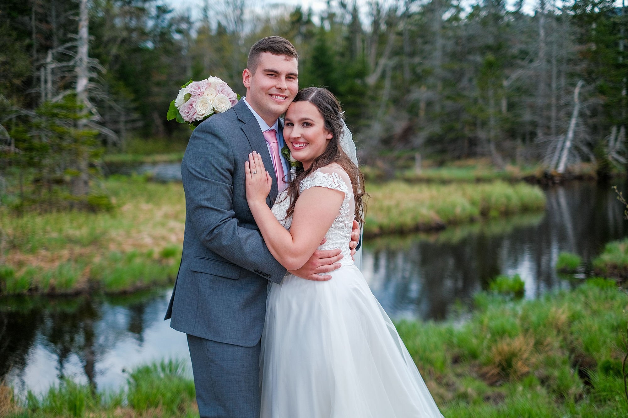 Bride and groom in a portrait at Pinkham Notch in the White Mountains of NH