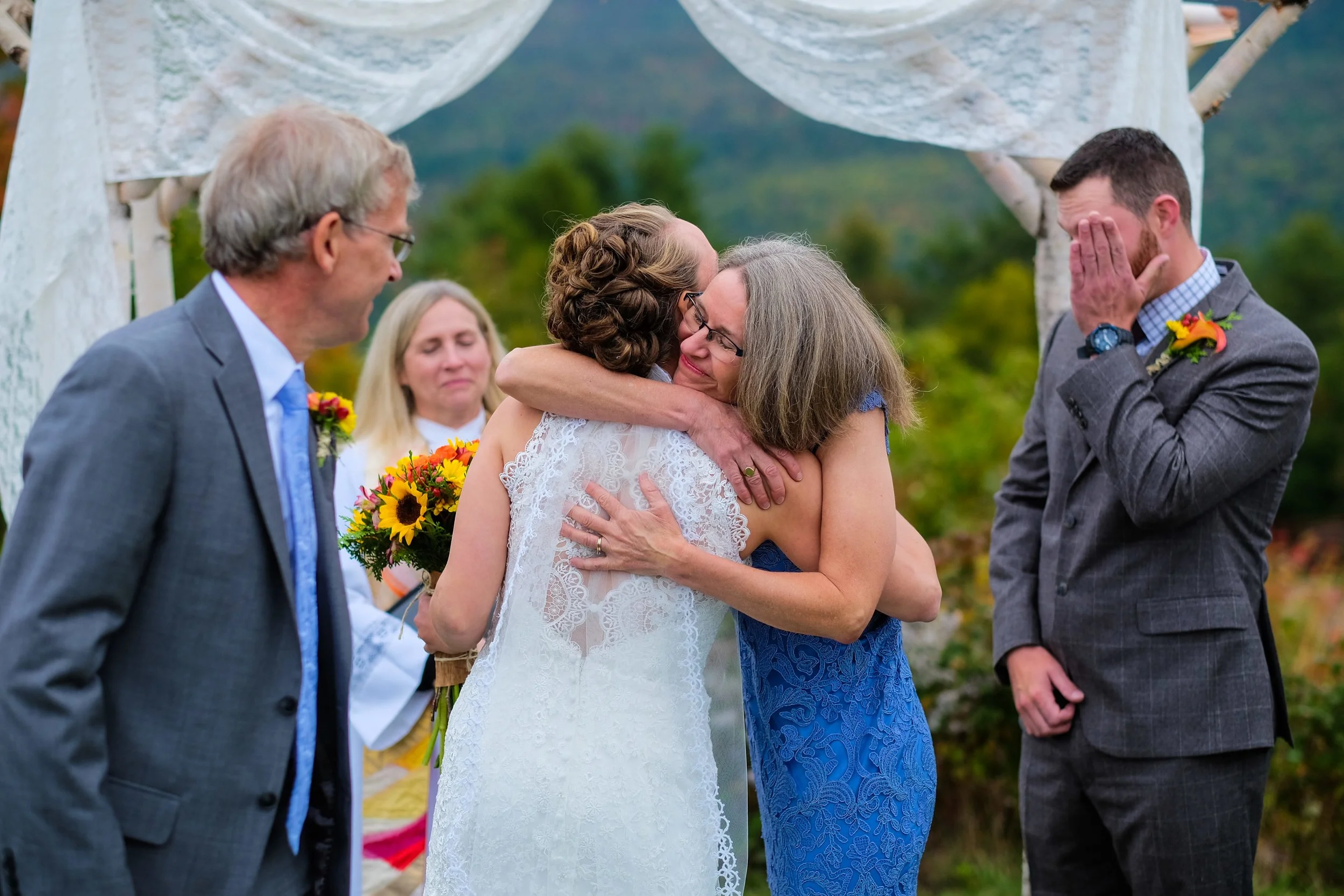white-mountains-nh-wedding-emotional-family-hug-ceremony.jpg