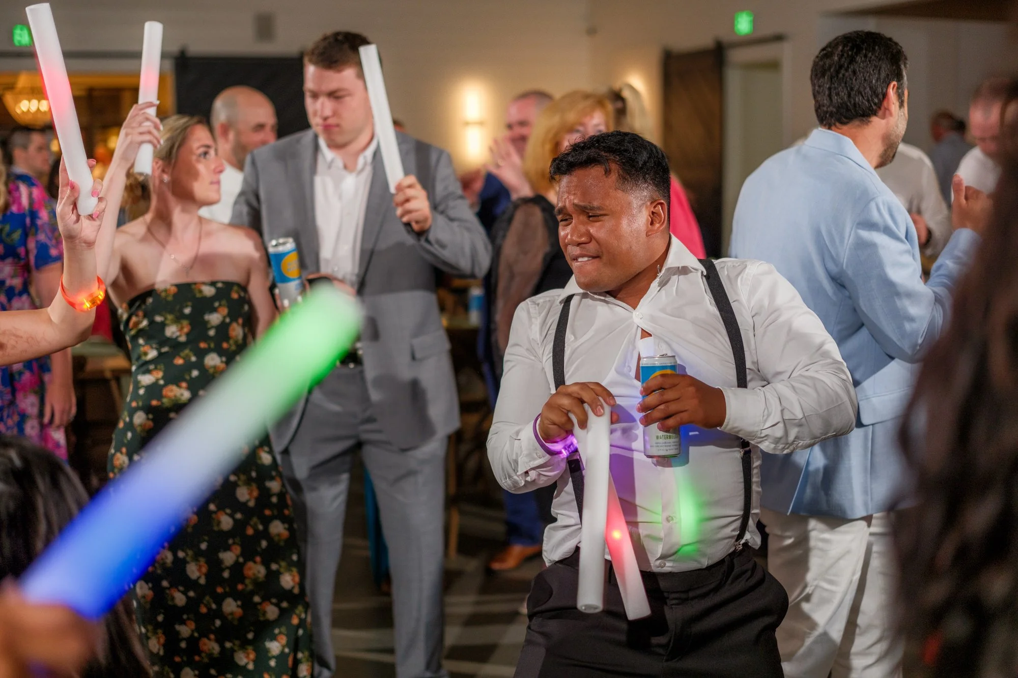 Reception dance floor with glowing light sticks at Hyla Brook Estate wedding
