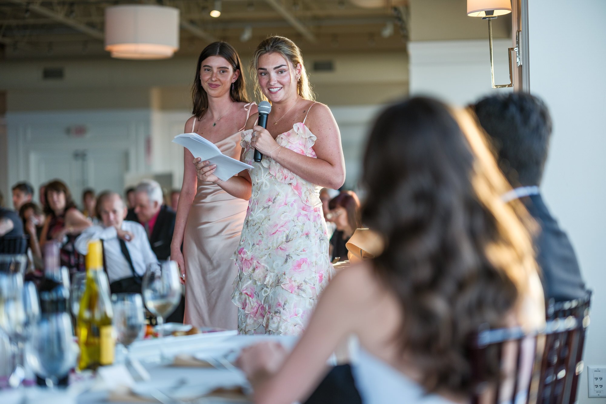 Wedding guests giving a toast during the reception at Blue Ocean Event Center in Salisbury, MA.