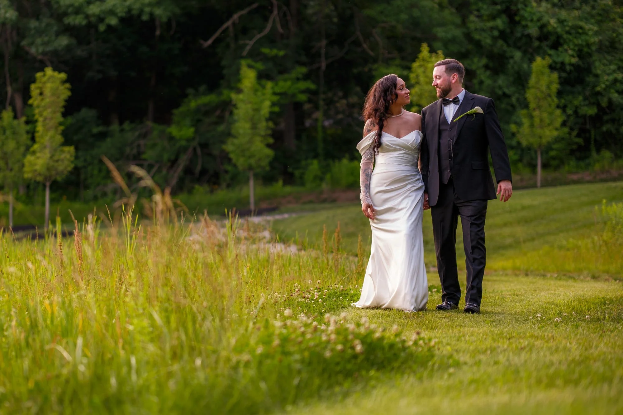 Bride and groom portrait in the field at Hyla Brook Estate